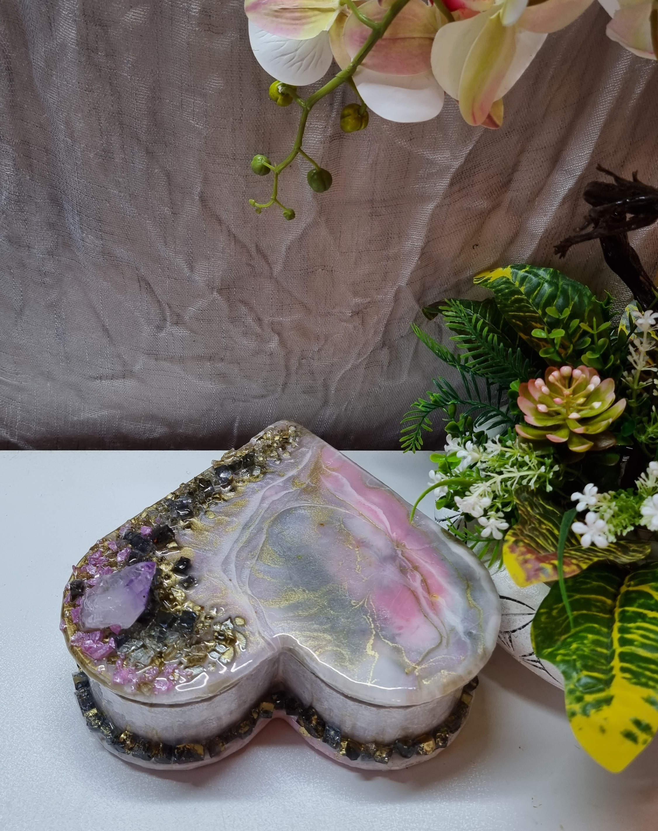 Heart-shaped pink-coloured epoxy-resin coated jewellery box adorned with natural amethysts