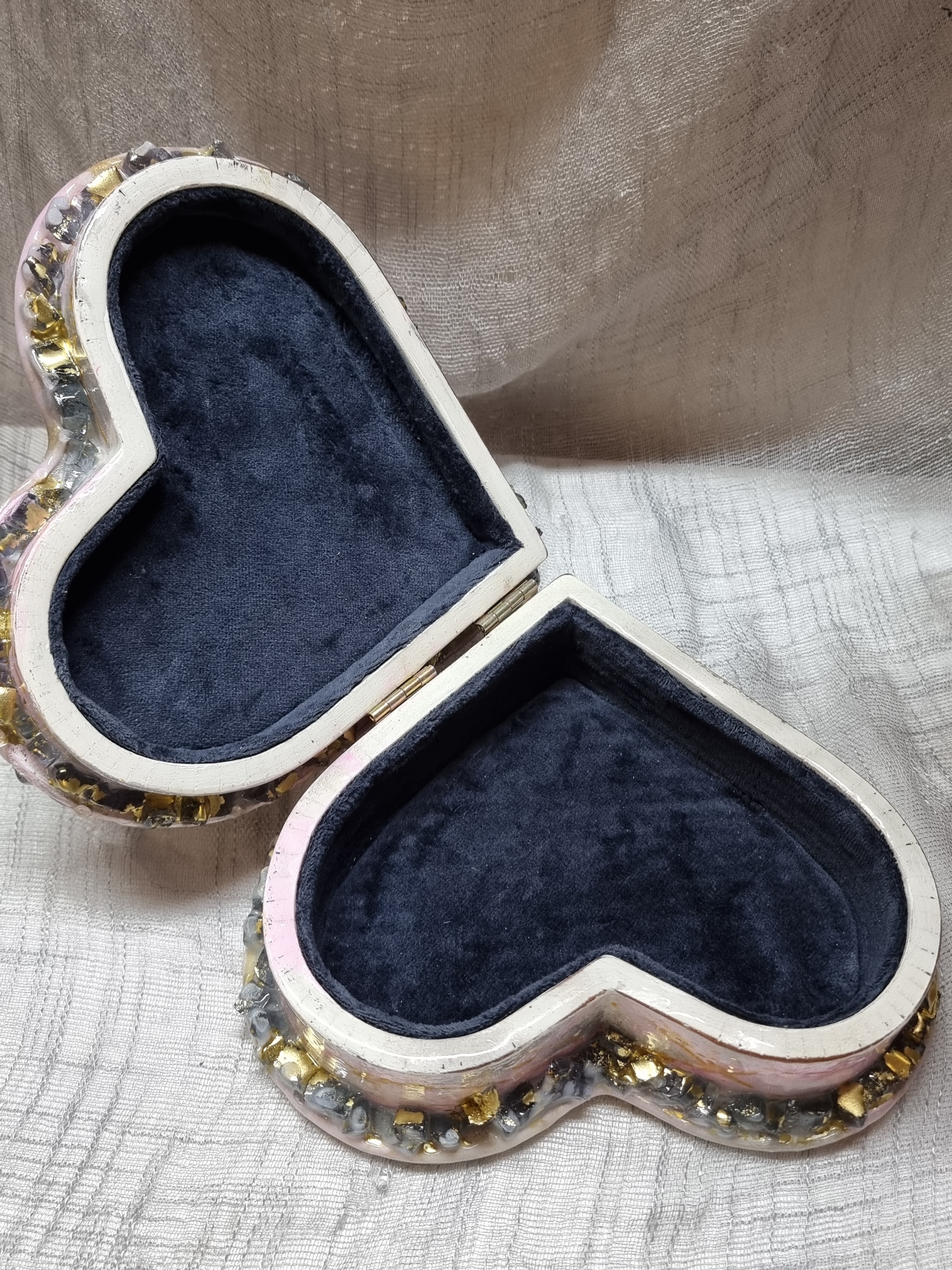 Heart-shaped pink-coloured epoxy-resin coated jewellery box adorned with natural amethysts