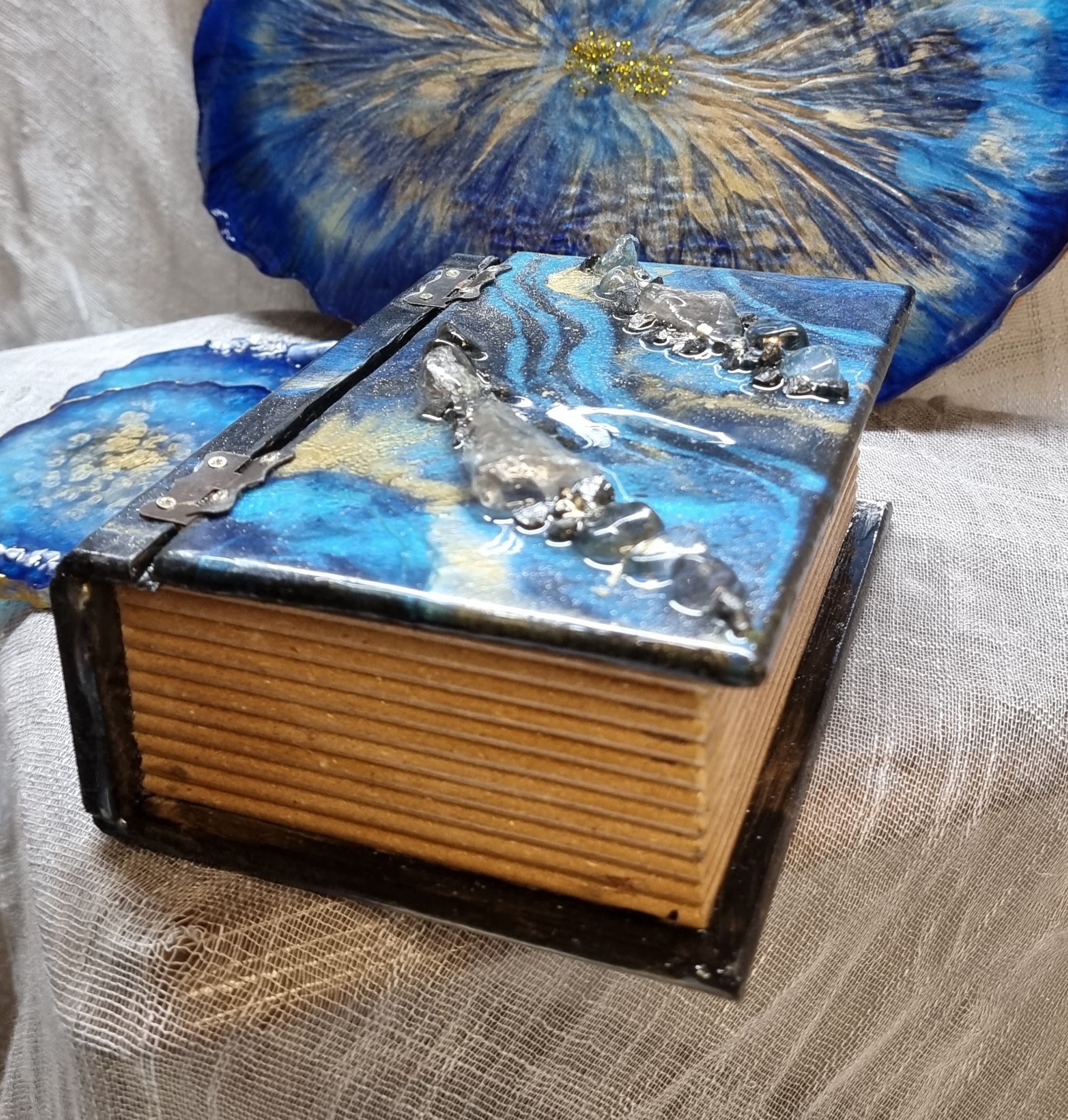 Rectangular blue-coloured epoxy-resin coated jewellery box adorned with natural quartz stones
