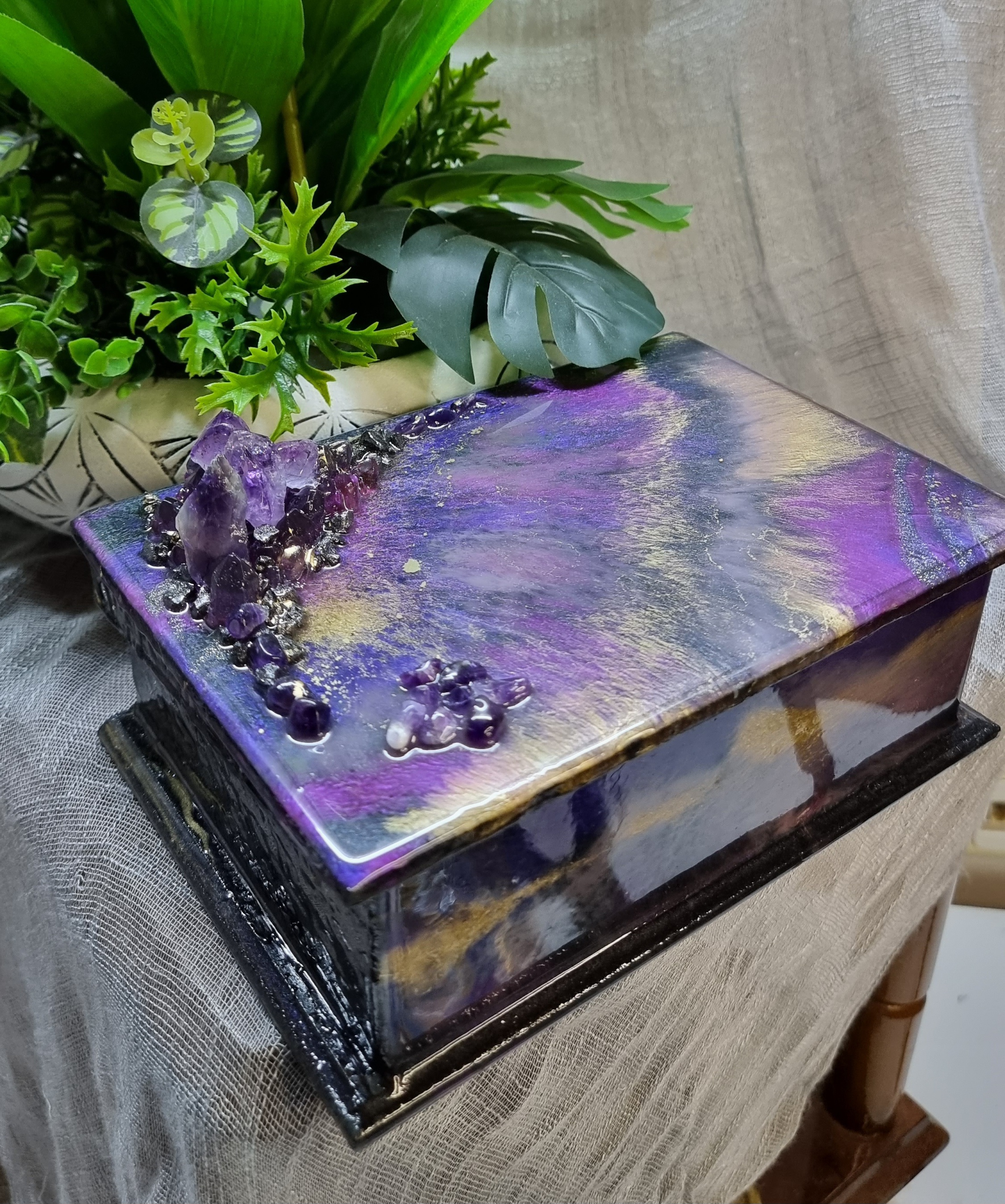 Rectangular purple-coloured epoxy-resin coated jewellery box adorned with natural amethyst stones