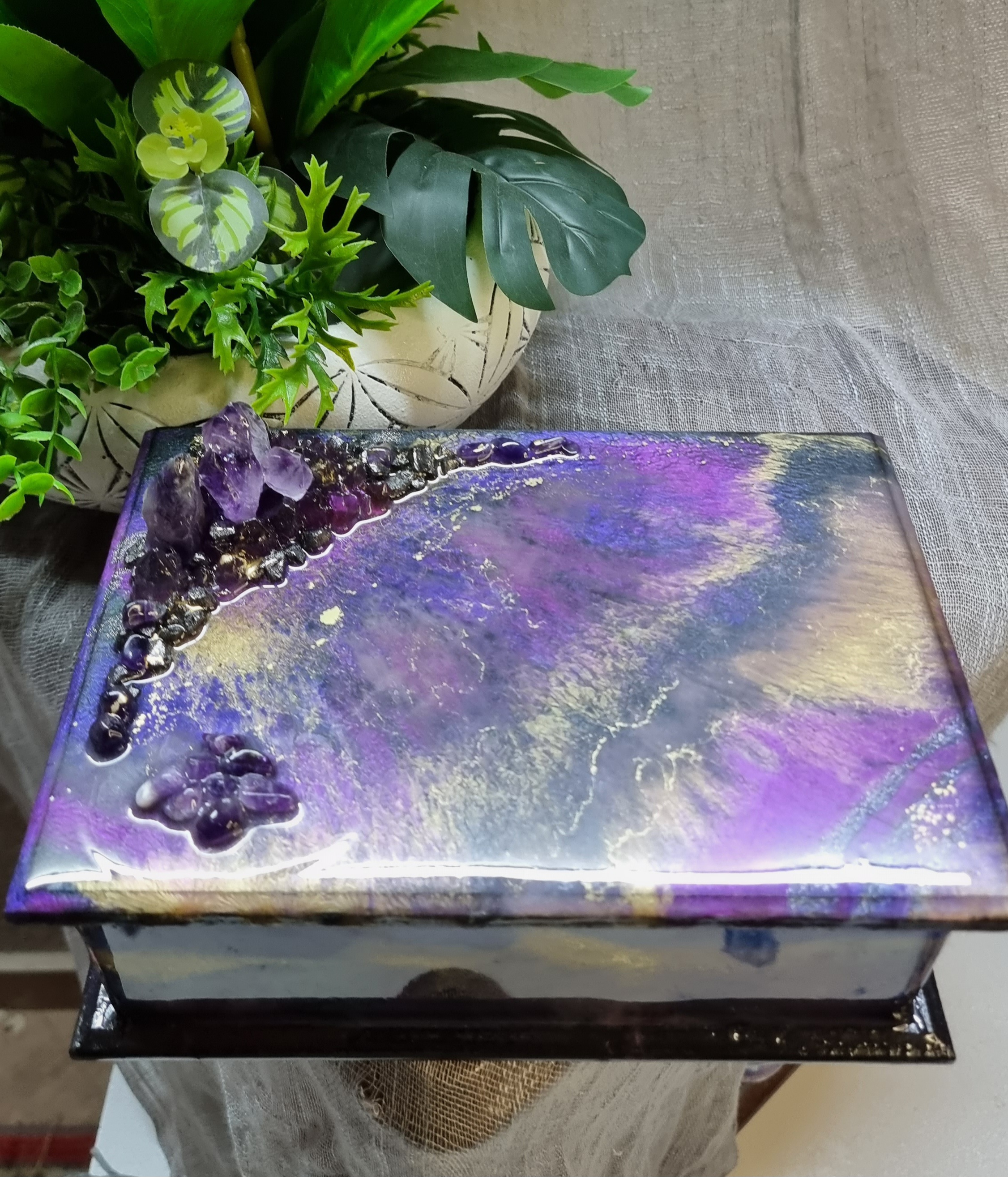 Rectangular purple-coloured epoxy-resin coated jewellery box adorned with natural amethyst stones
