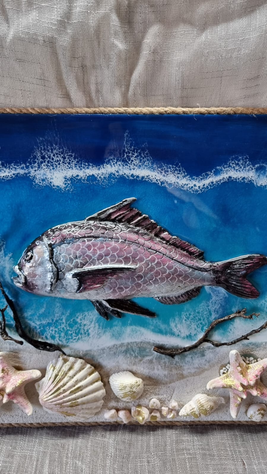 Epoxy-resin coated sea themed painting featuring 1 fish. Dimensions: 60x40 cm. Weight: approx 3 kg.