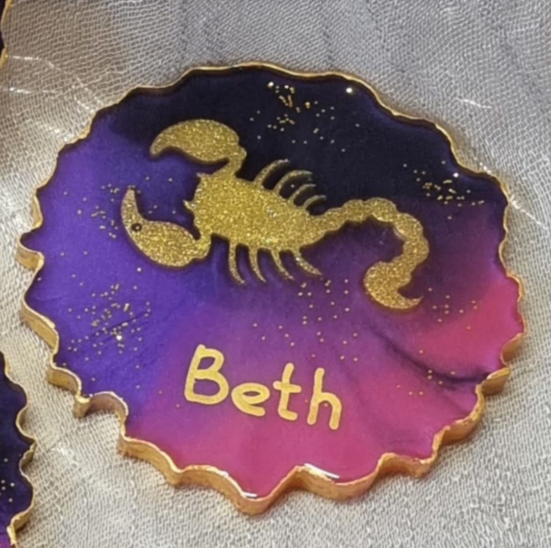 Personalised epoxy-resin coasters featuring Zodiac signs (star signs)