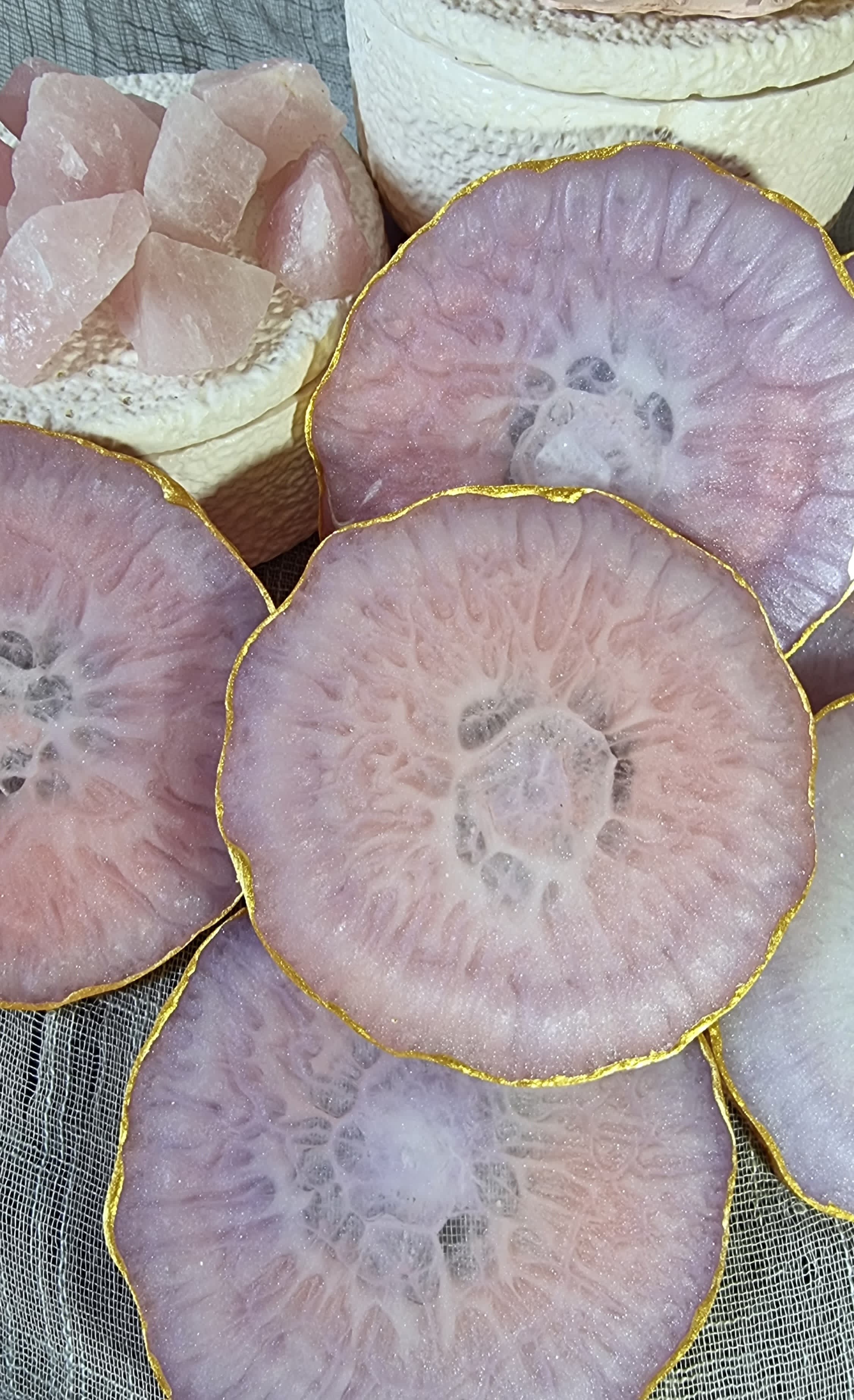 Epoxy-resin coasters in pale pink colour 