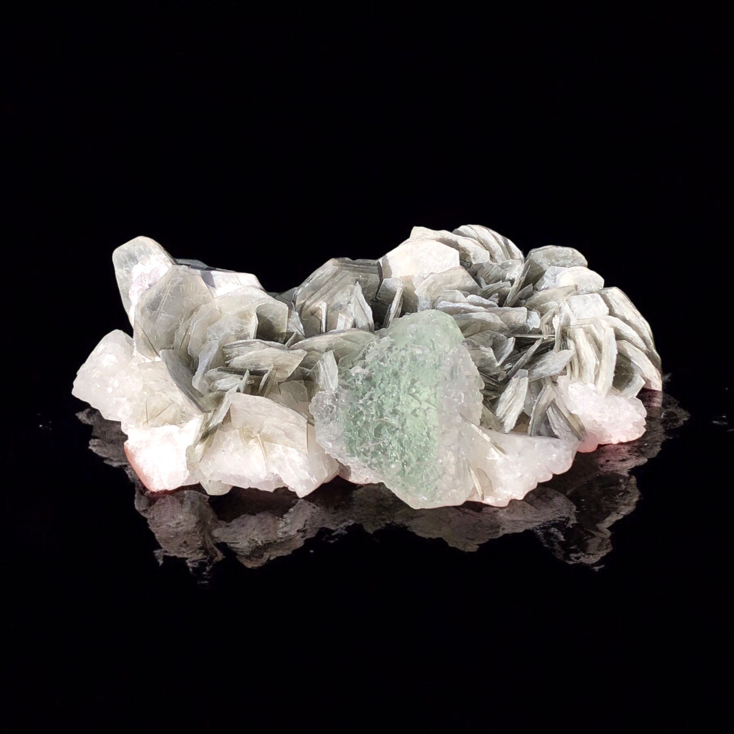 An Aesthetic Green Fluorite Sphere Rested on Flower Shape Muscovite.