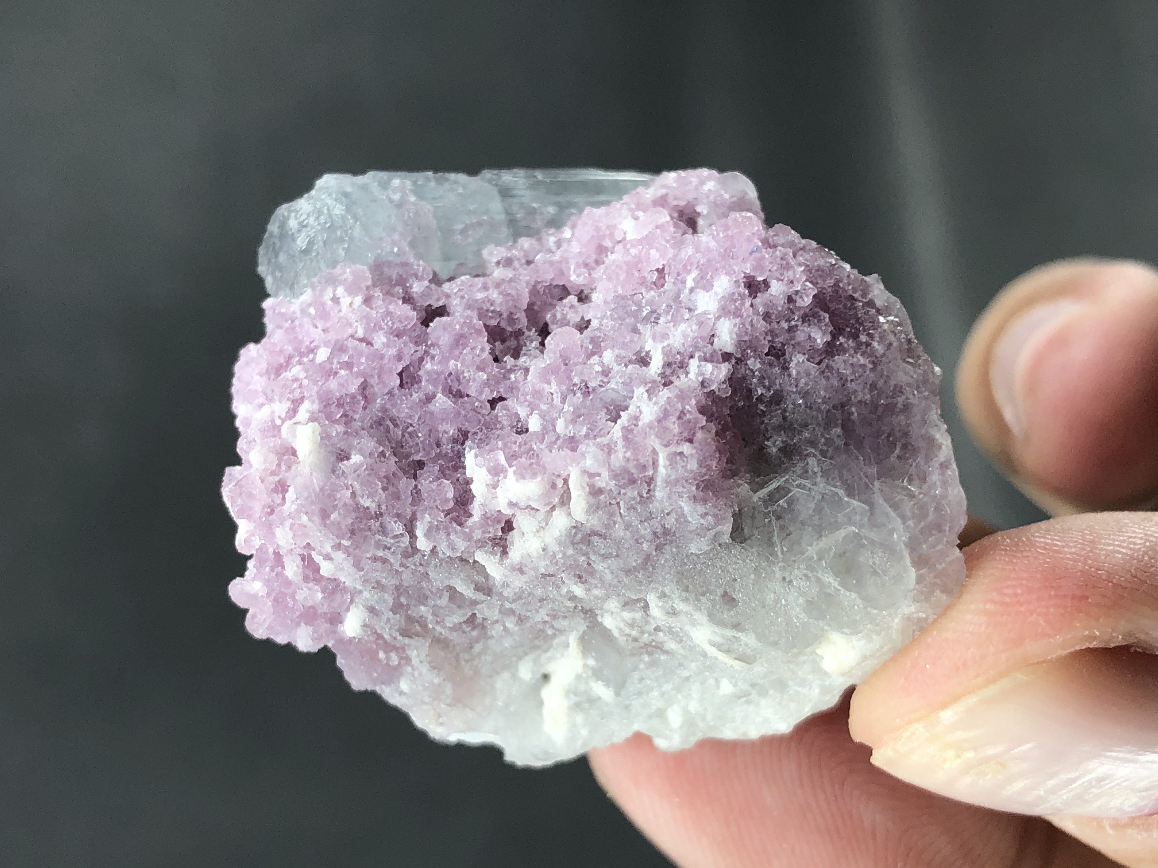 Natural Tourmaline Crystal Rested on Lepidolite. 