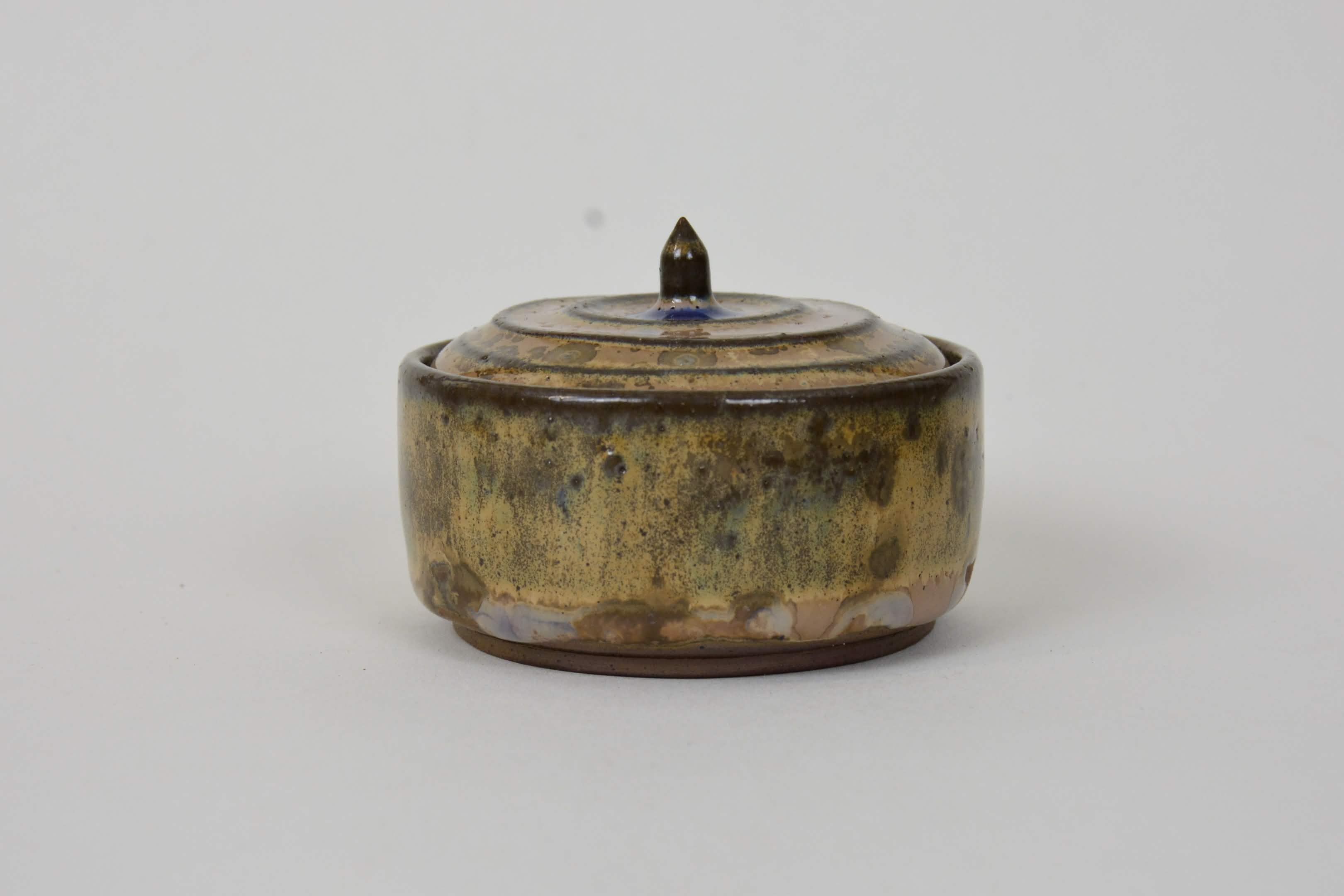 A stoneware Ceramic Lidded Jar in Wood Ash Crystalline Glaze