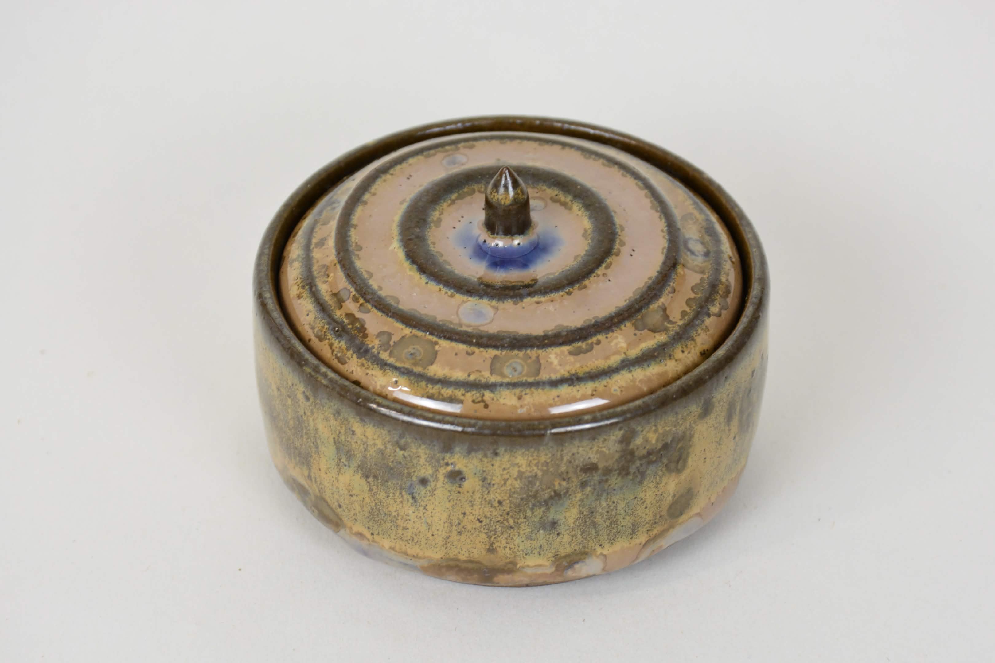 A stoneware Ceramic Lidded Jar in Wood Ash Crystalline Glaze