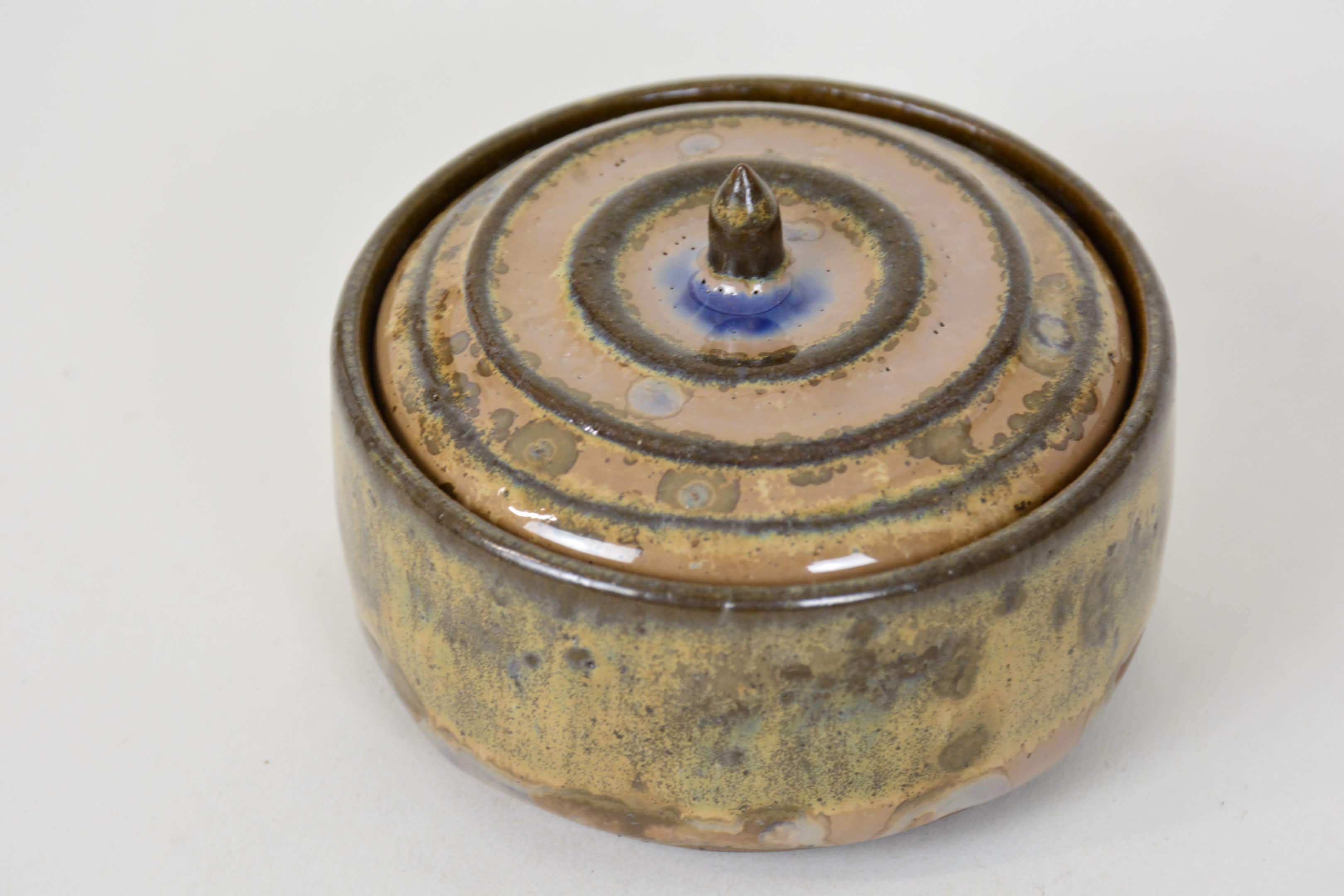 A stoneware Ceramic Lidded Jar in Wood Ash Crystalline Glaze