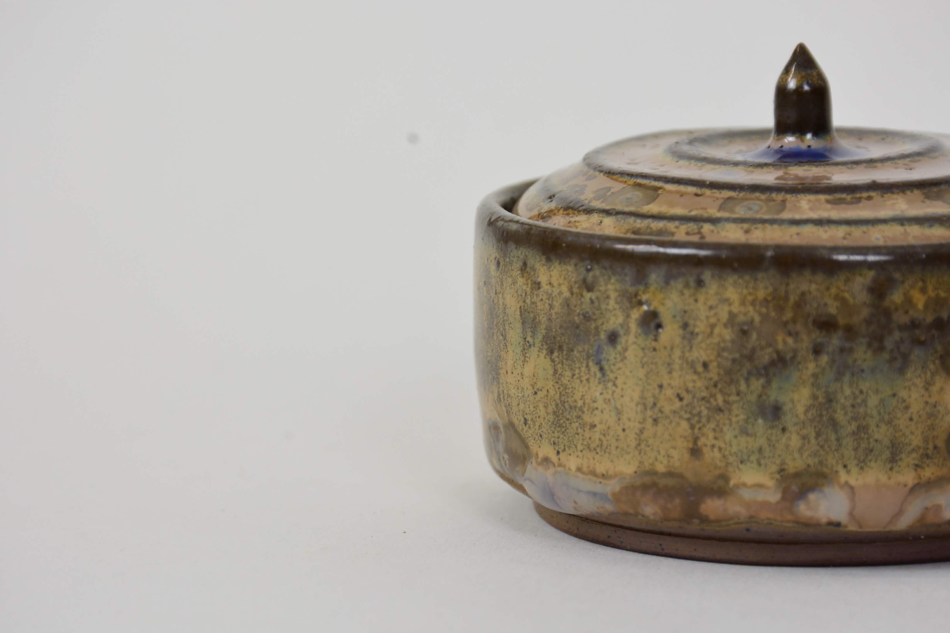 A stoneware Ceramic Lidded Jar in Wood Ash Crystalline Glaze