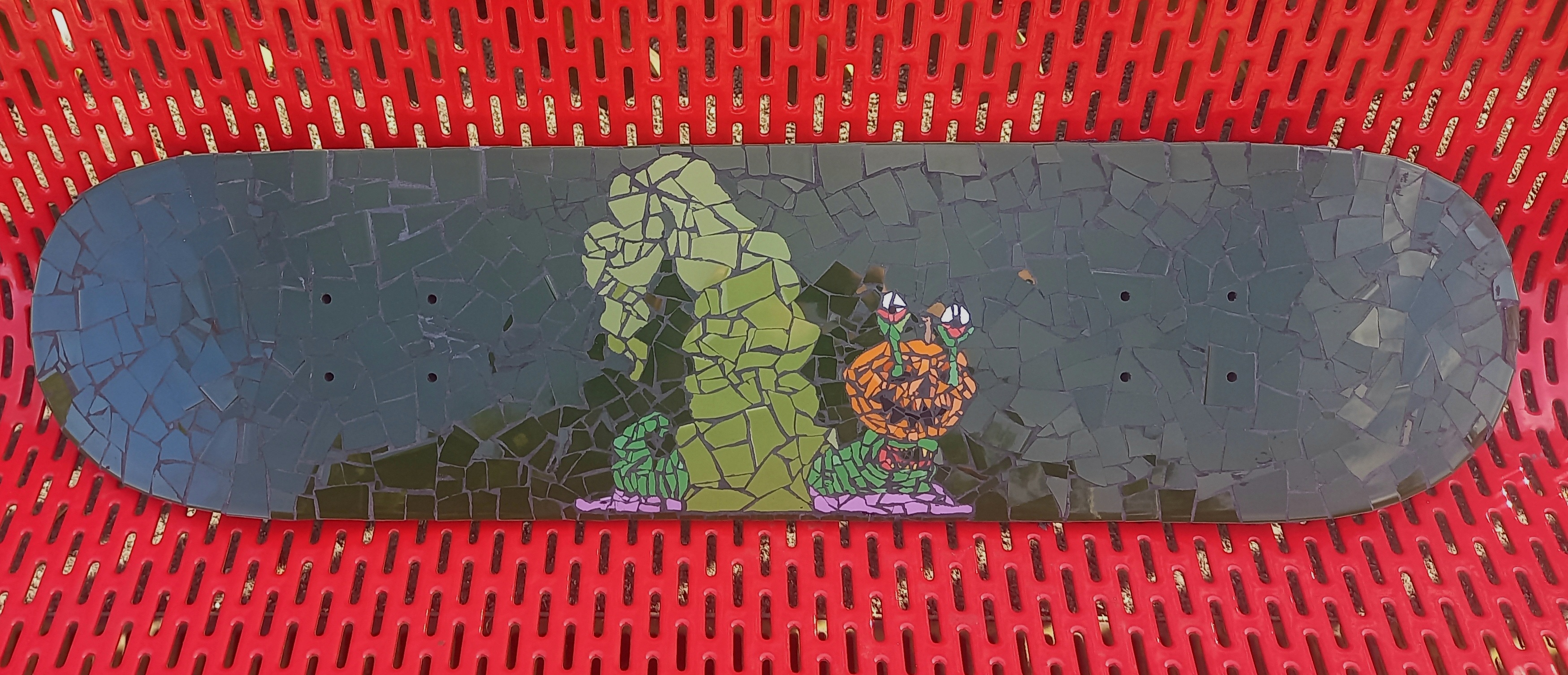 Budslug mosaic skateboard