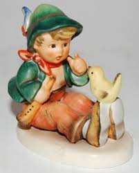 Porcelain Boy with Bird Figurine