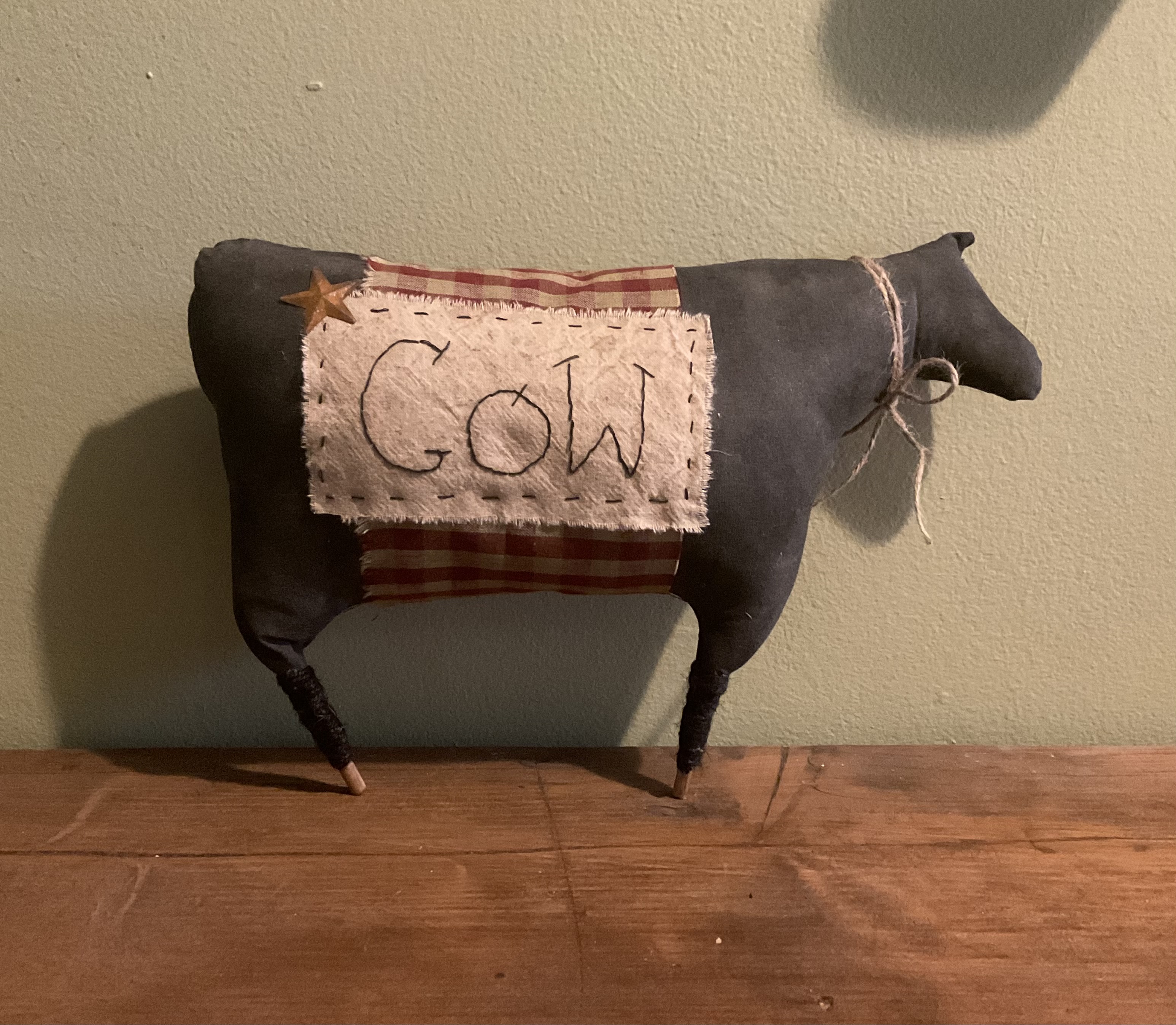 Large primitive shelf sitter cow