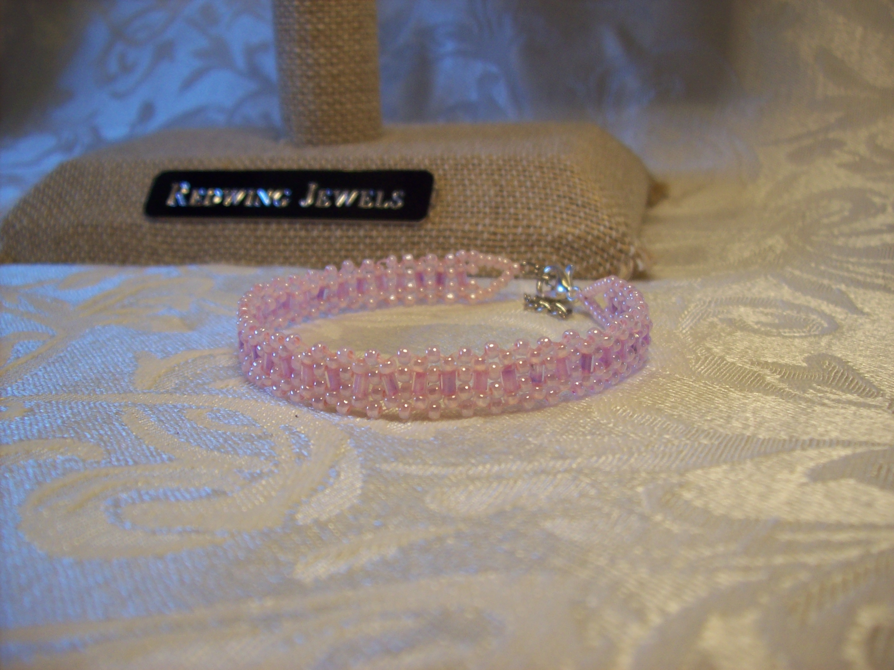 Pink Glass Lace Bracelet with a Silver Plated clasp 