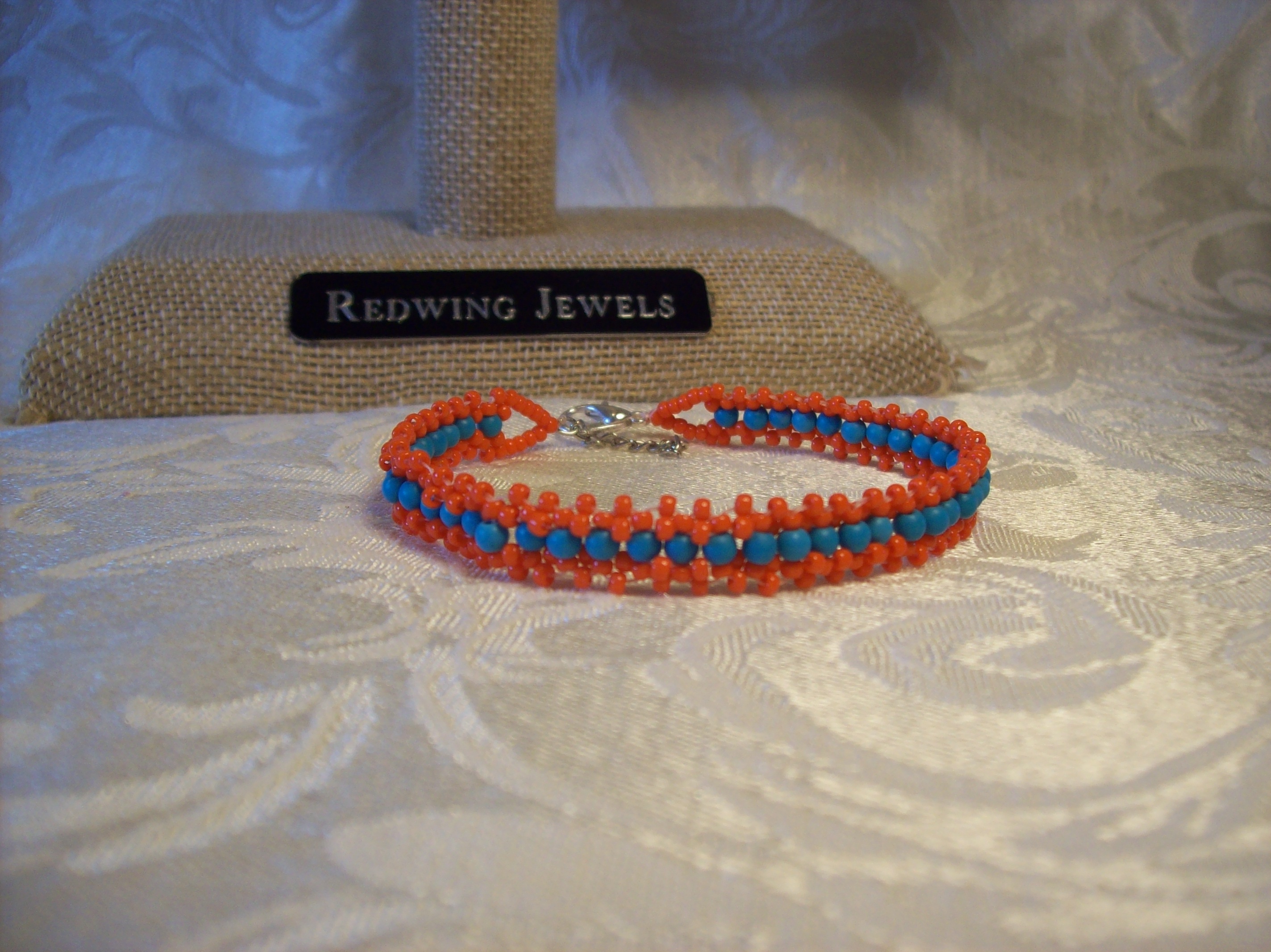 Orange and 3mm Round Blue glass Lace Bracelet with a Silver plated clasp 