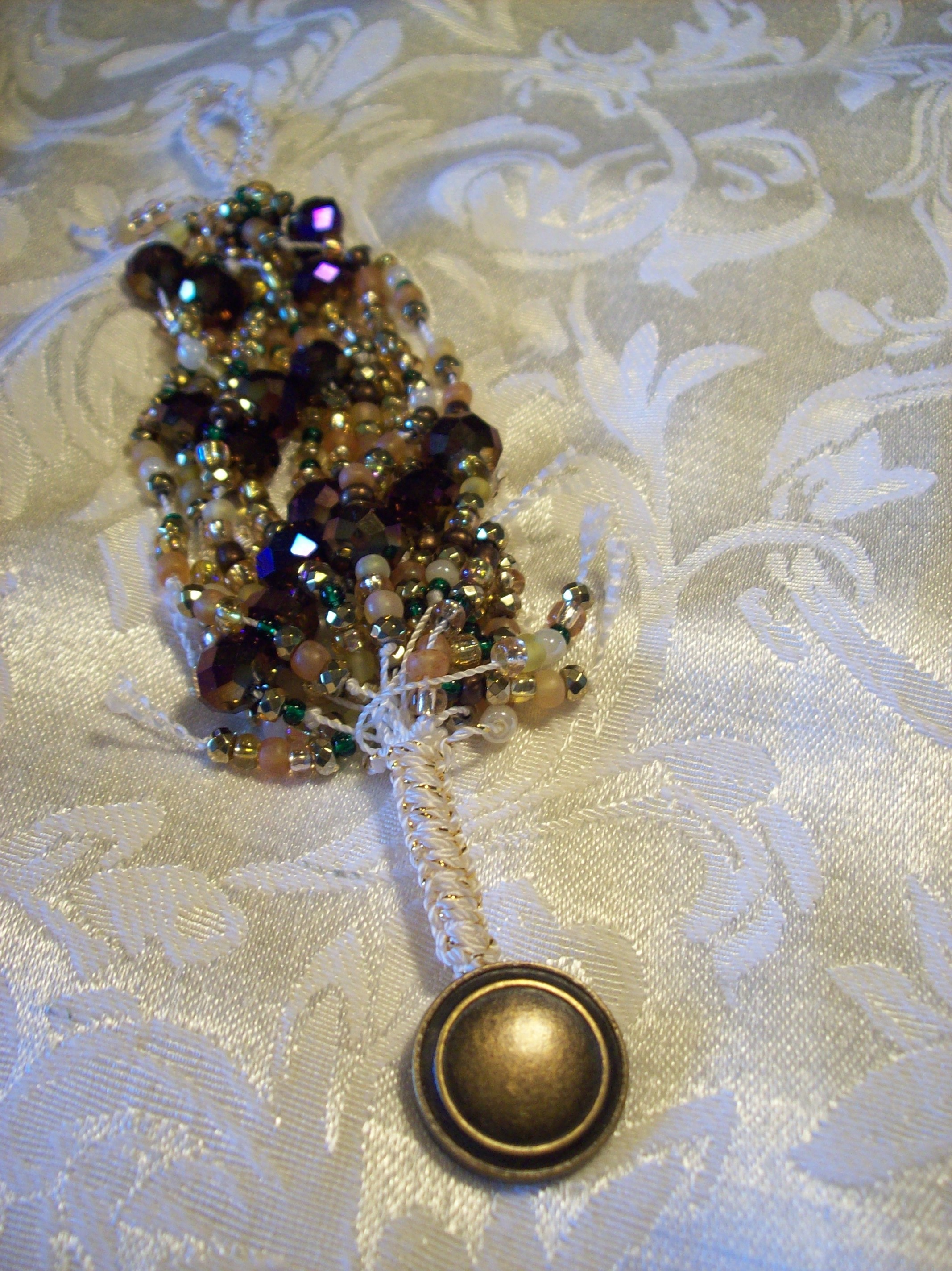 Purple and Gold Faceted Glass, Hematite Knotted Bracelet 