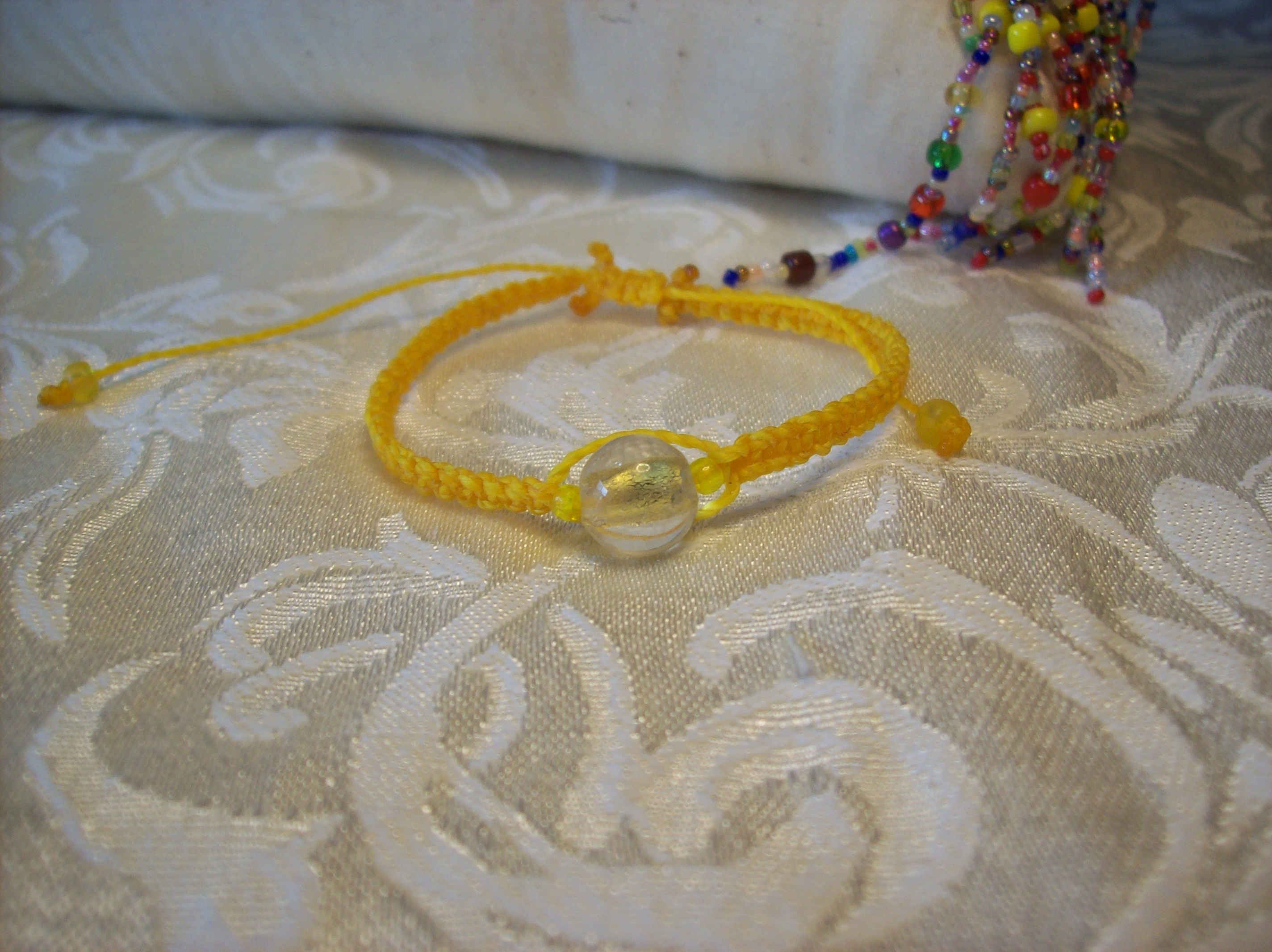 Yellow Lampwork foil center Macramé Bracelet