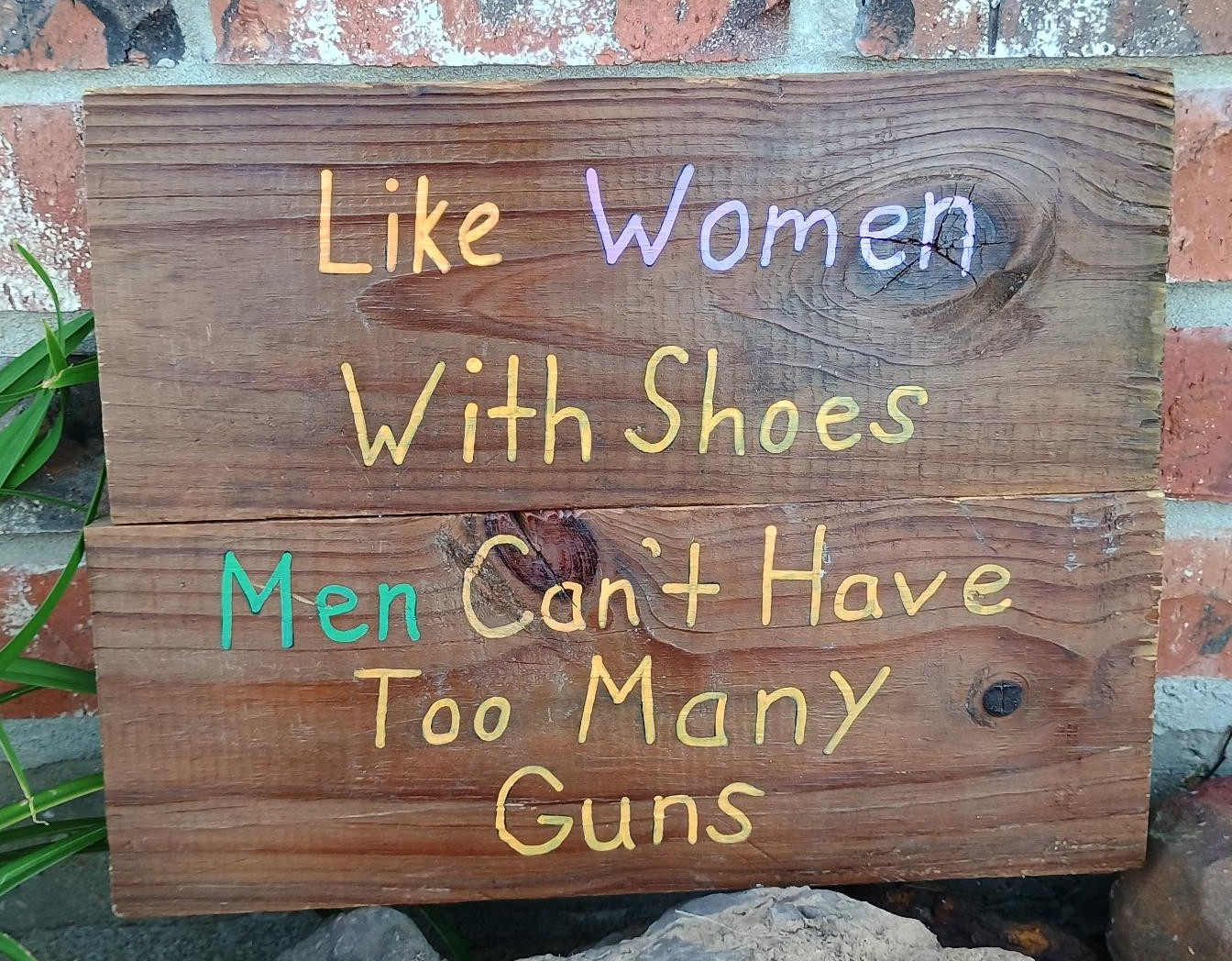 Shoes and Guns Sign