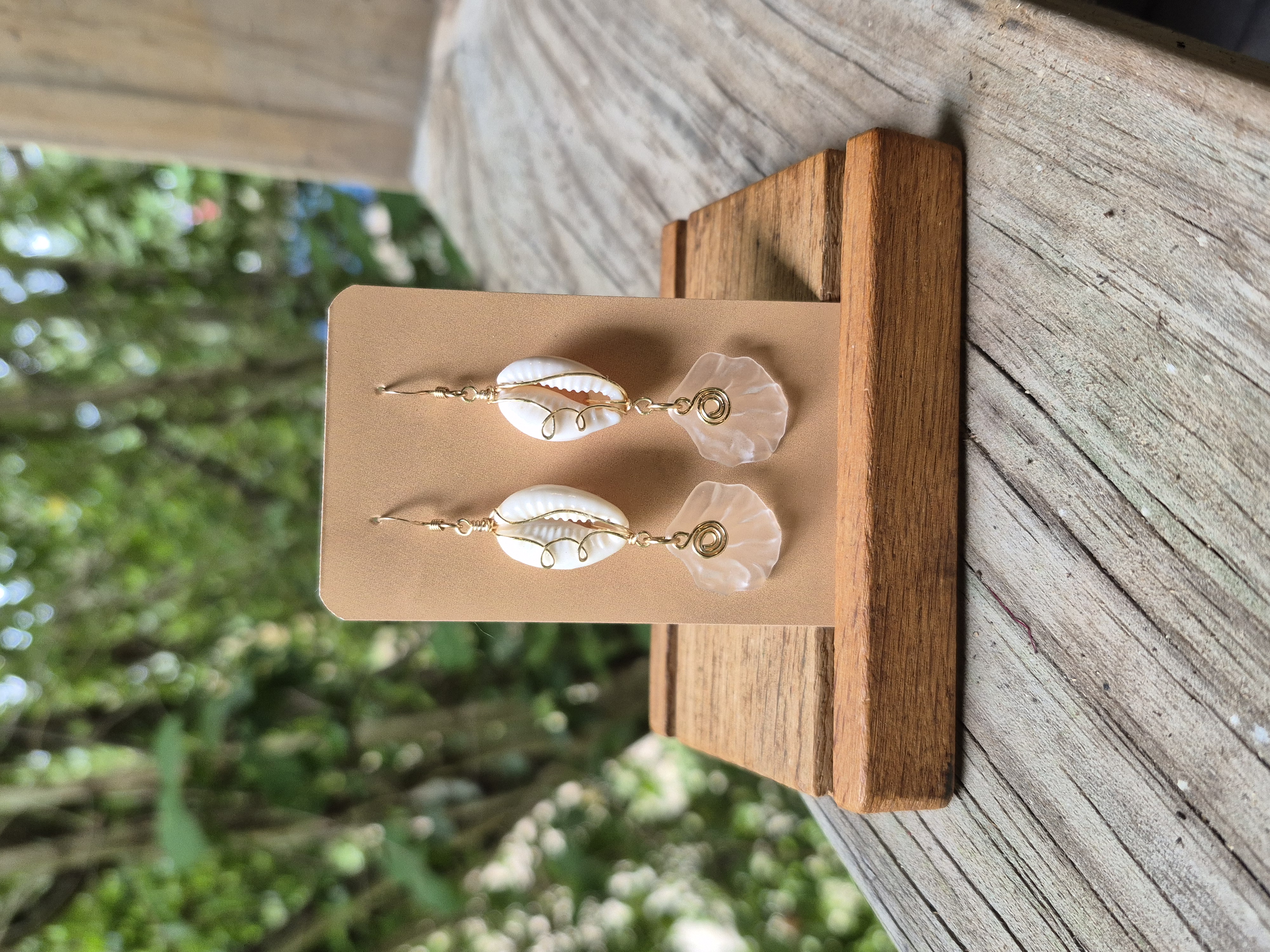 Gold wire wrapped cowrie earrings