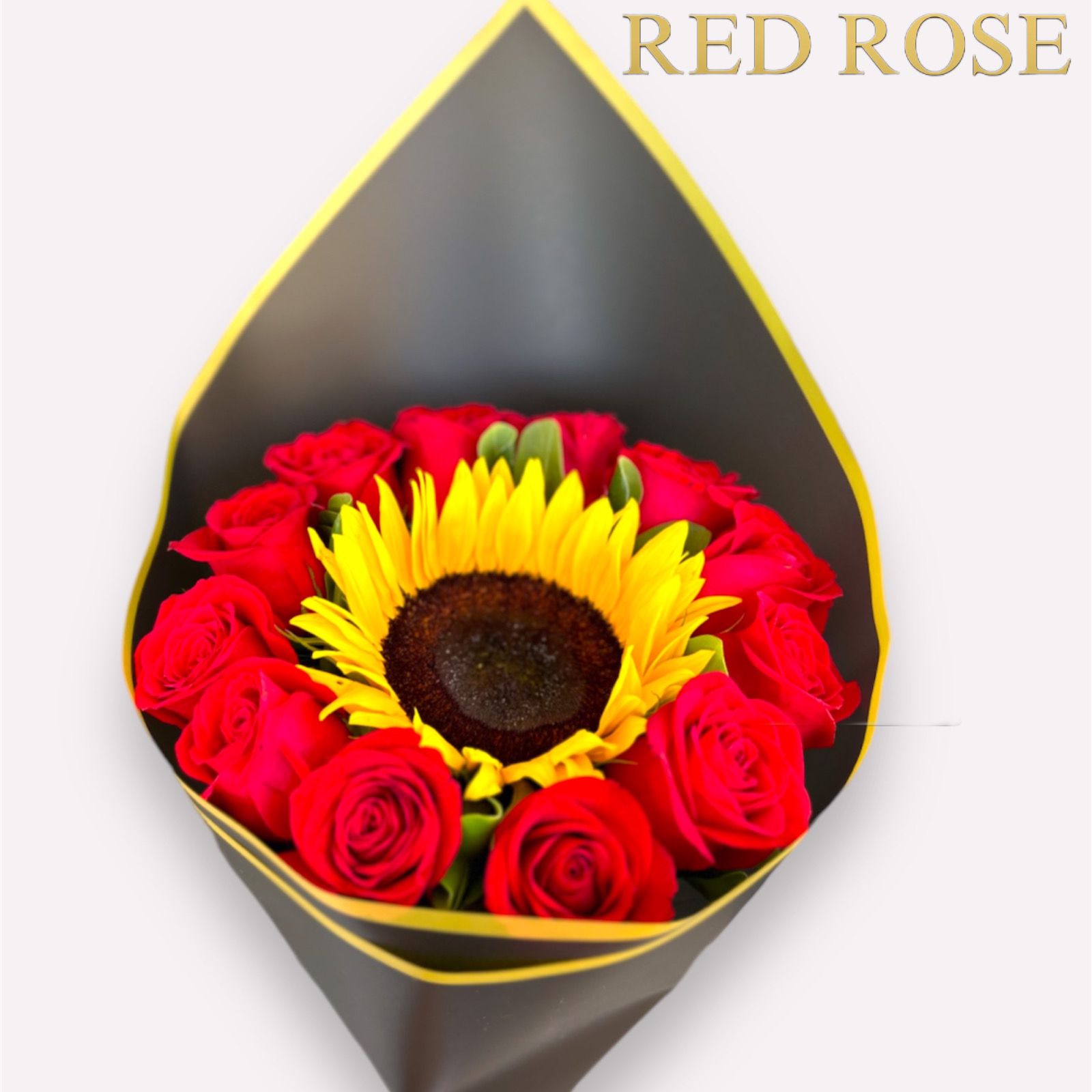 12 rosas rojas y un girasol en el medio