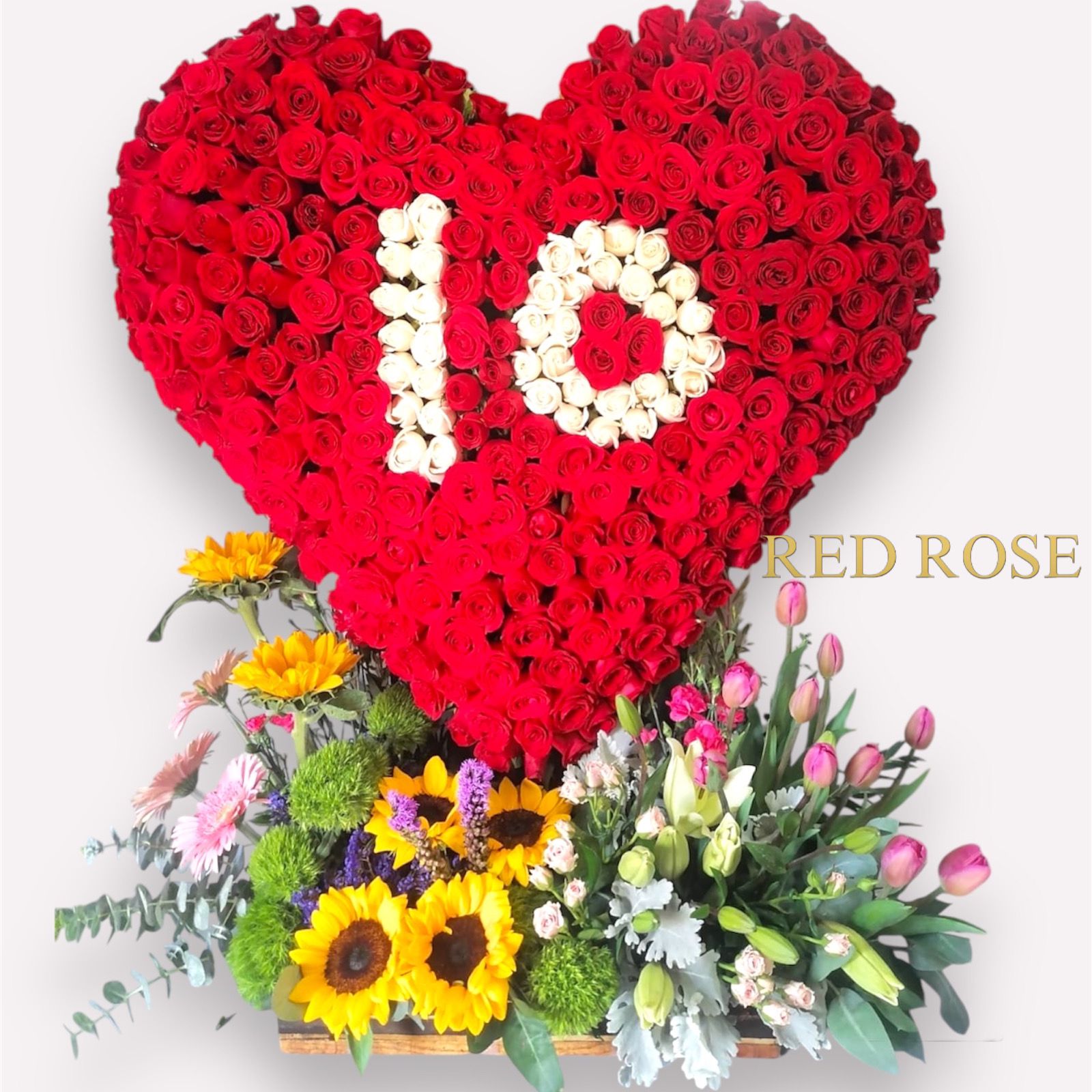 Arreglo con tulipanes girasoles Lizian, tus rosas y Lilis, junto con un corazón de 250 rosas