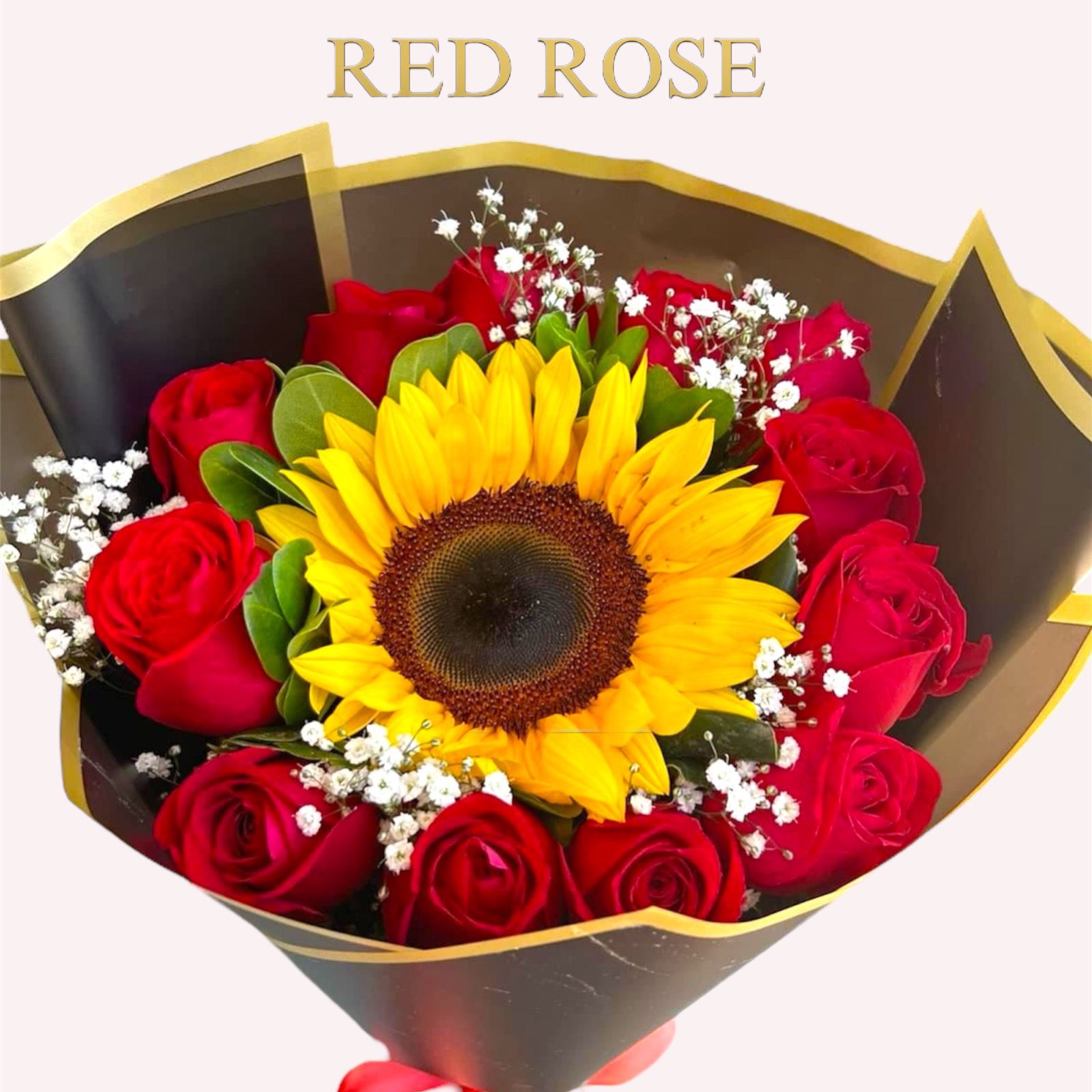 Ramo de 12 rosas y un girasol con envoltura de Buquet 