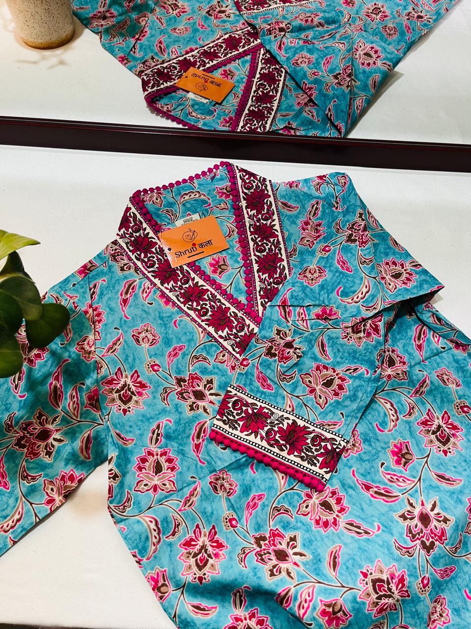 Chic Blue Floral Short Kurta with V-Neck Detailing – Perfect for Jeans