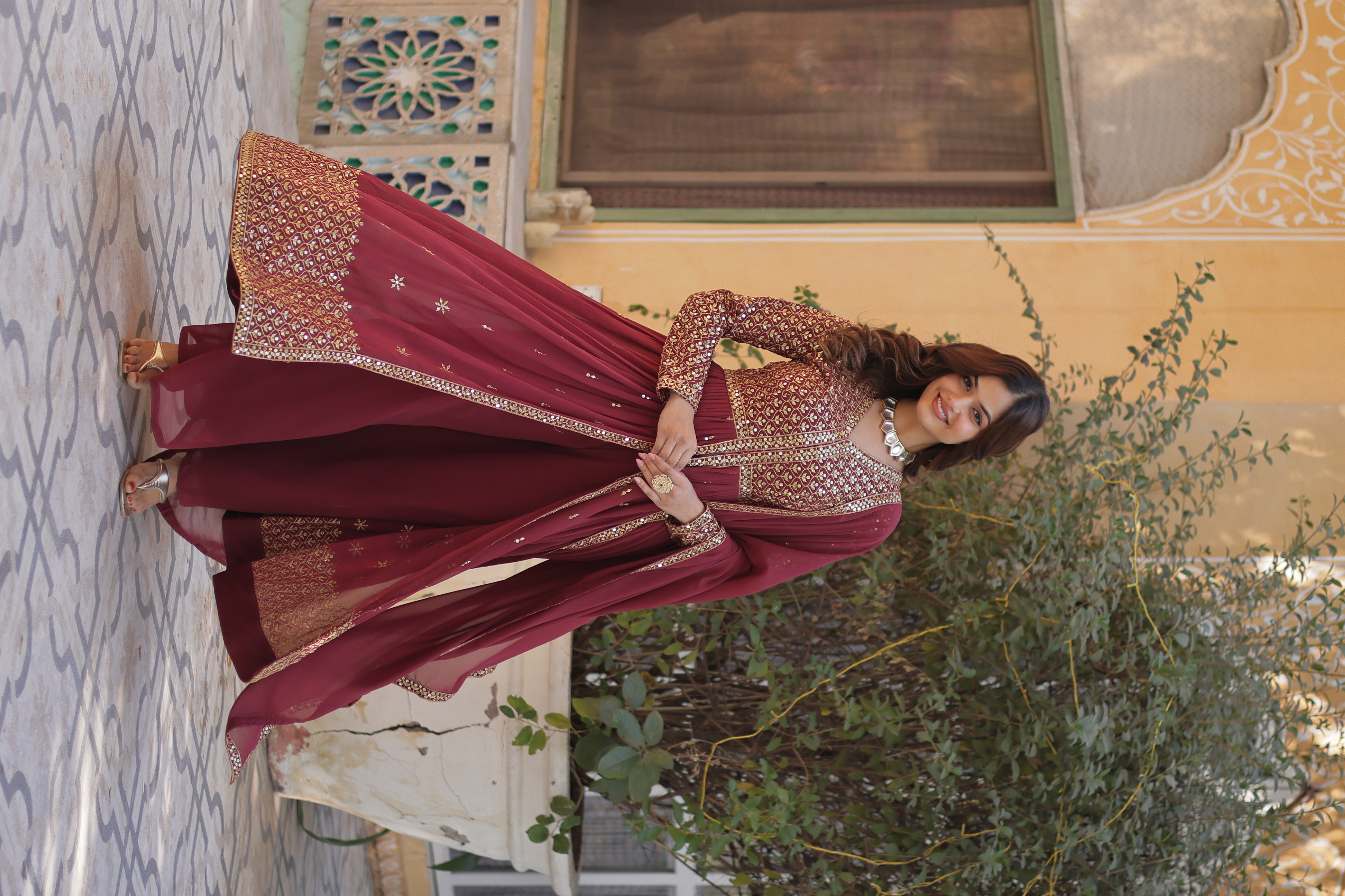 The intricate embossed zari thread work and studded sequins add a unique texture and gleam Anarkali Salwar Kameez