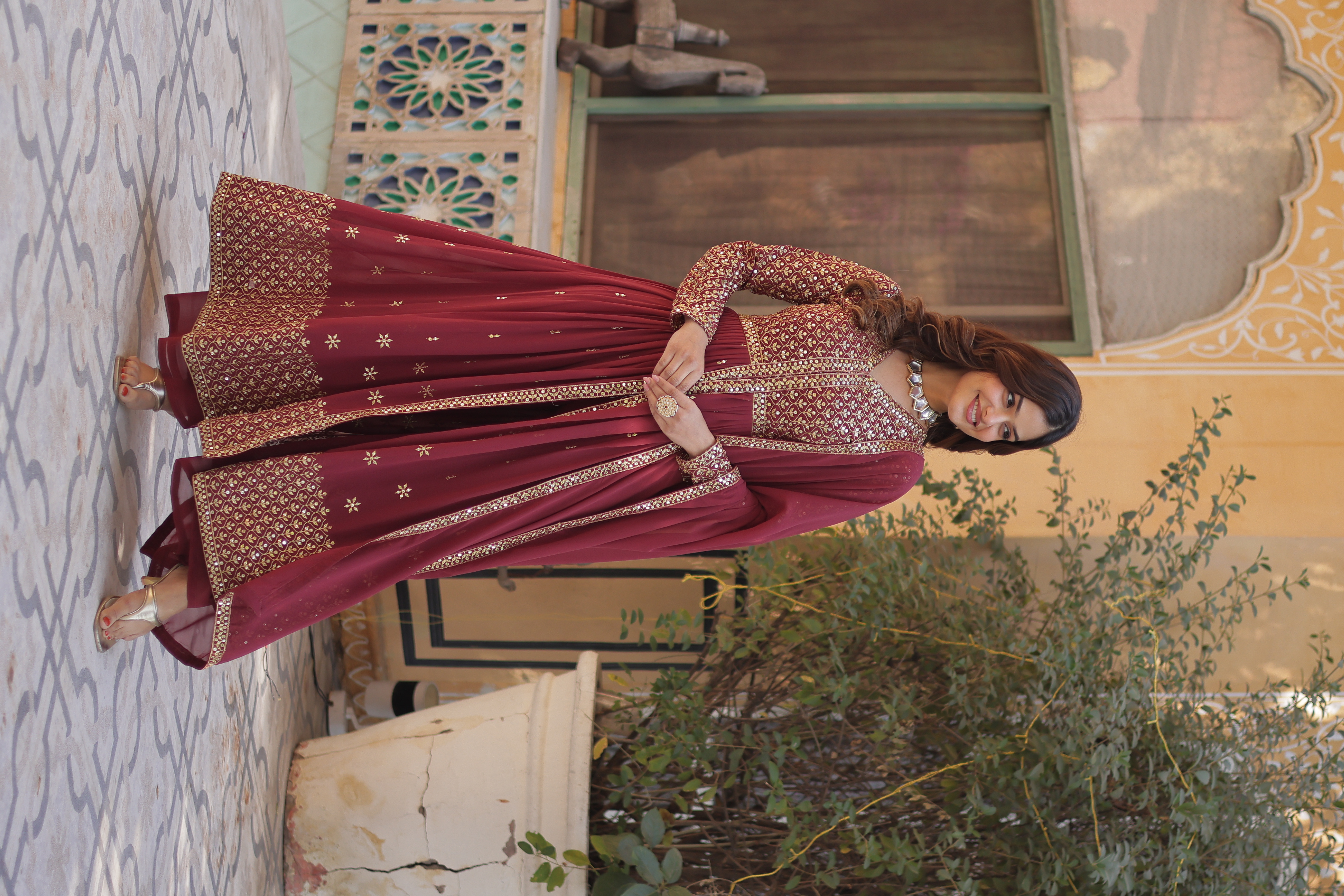 The intricate embossed zari thread work and studded sequins add a unique texture and gleam Anarkali Salwar Kameez