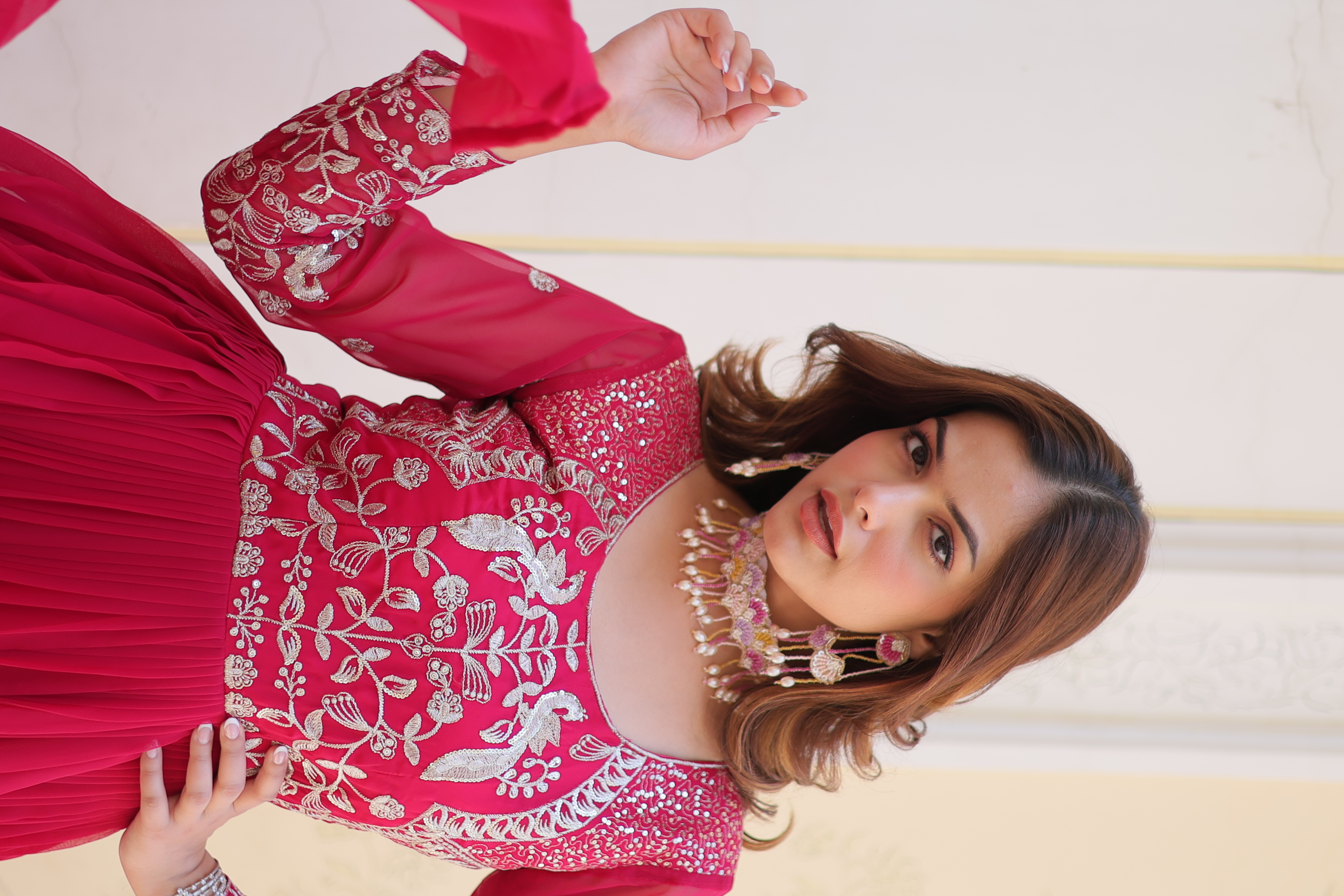 This vibrant pink gown is the perfect choice for your Eid celebrations