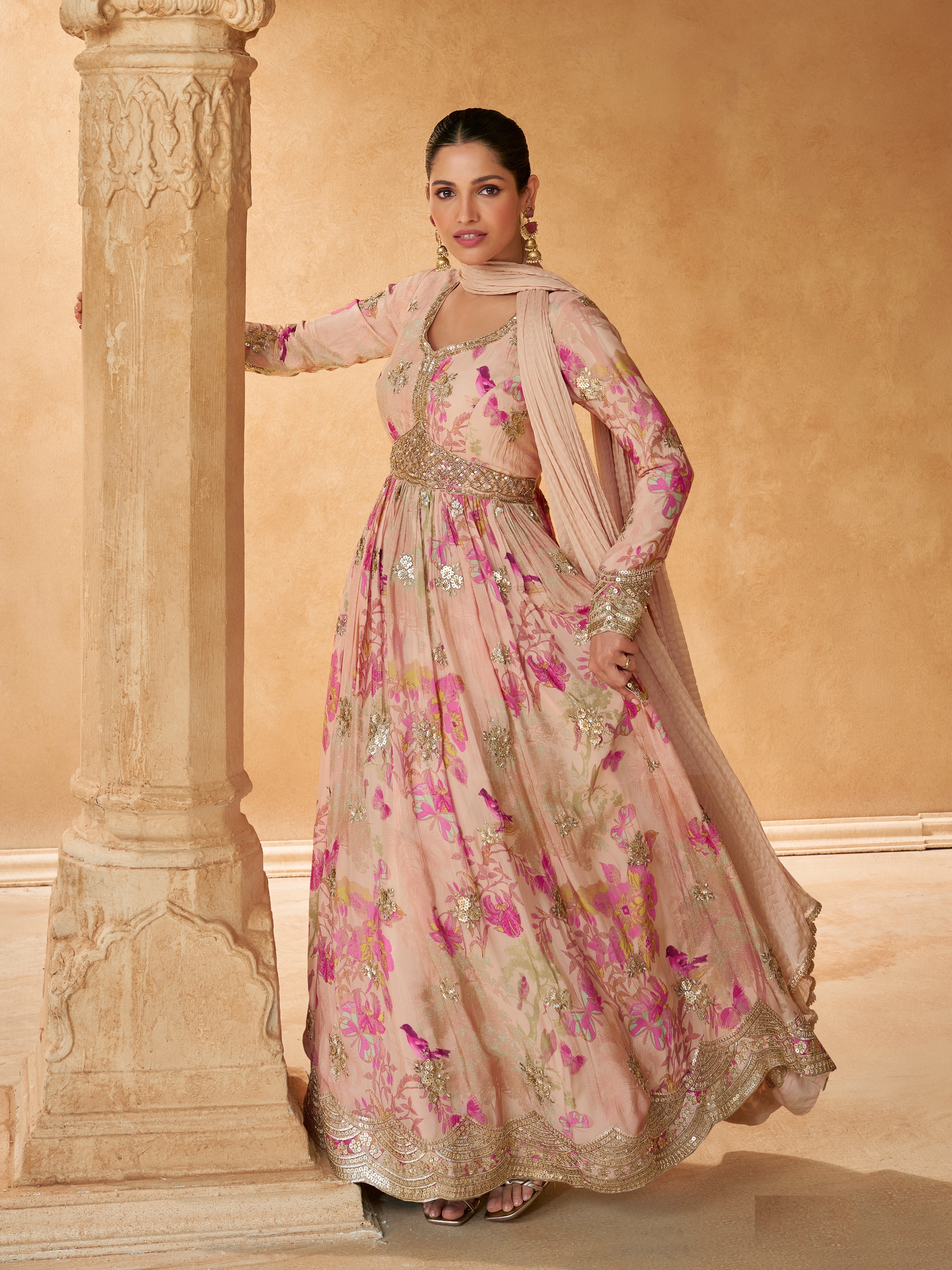 Celebrate the joy of Eid in style with this captivating gown, adorned with sequinned embroidery