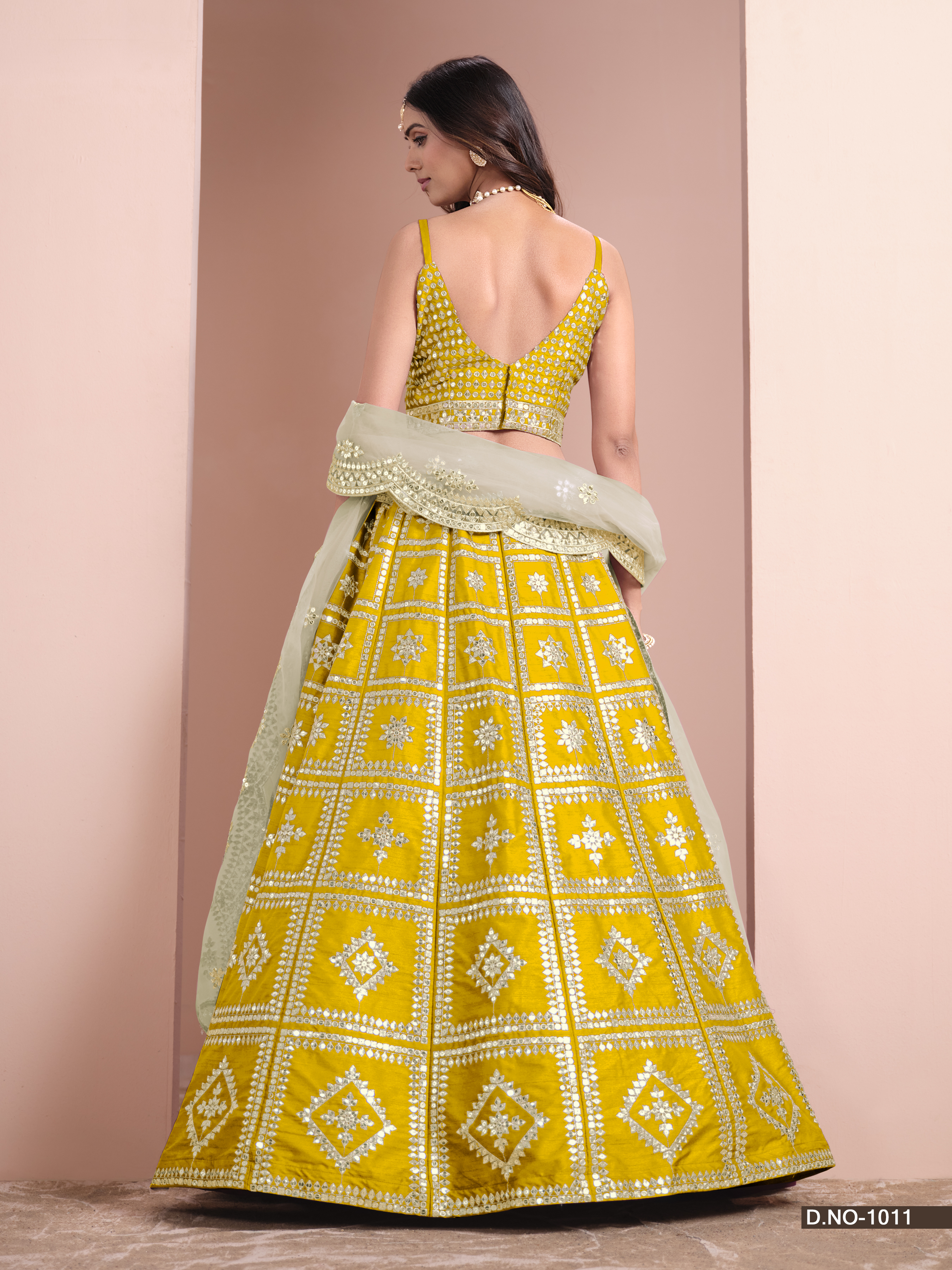 Embrace your timeless elegance with the stunning yellow art silk umbrella lehenga, a true masterpiece that celebrates your enduring beauty.