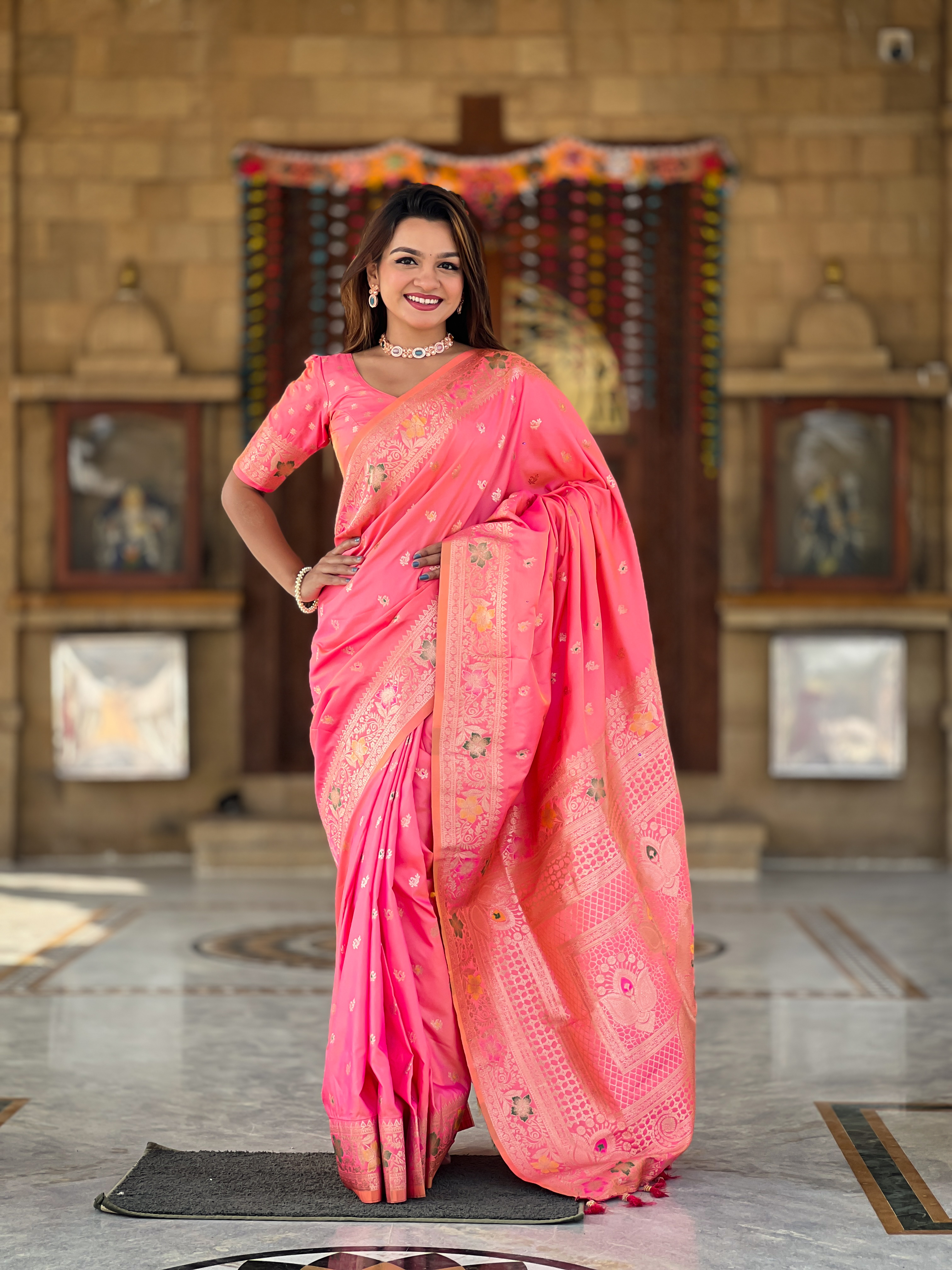Indulge in the charm of this pink Banarasi silk saree