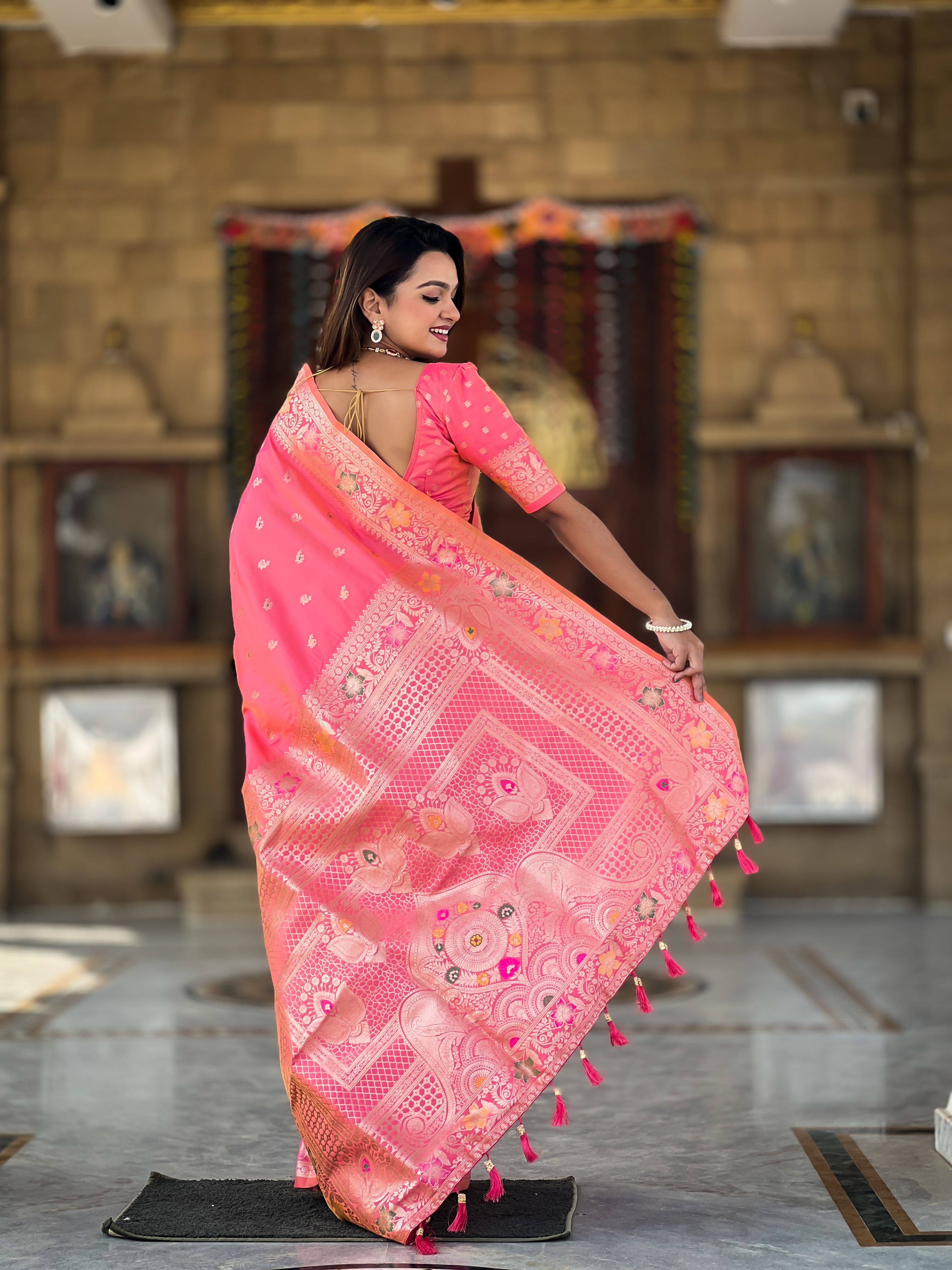 Indulge in the charm of this pink Banarasi silk saree