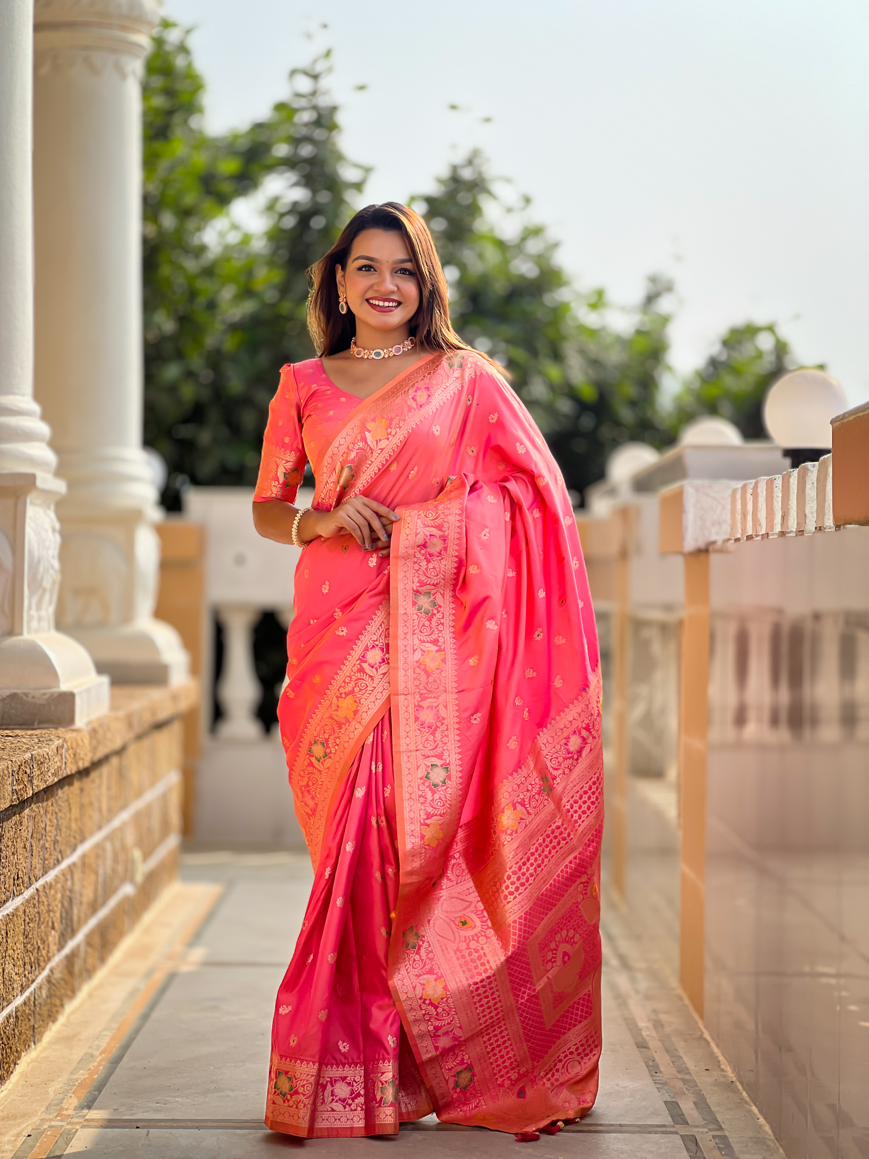 Indulge in the charm of this pink Banarasi silk saree