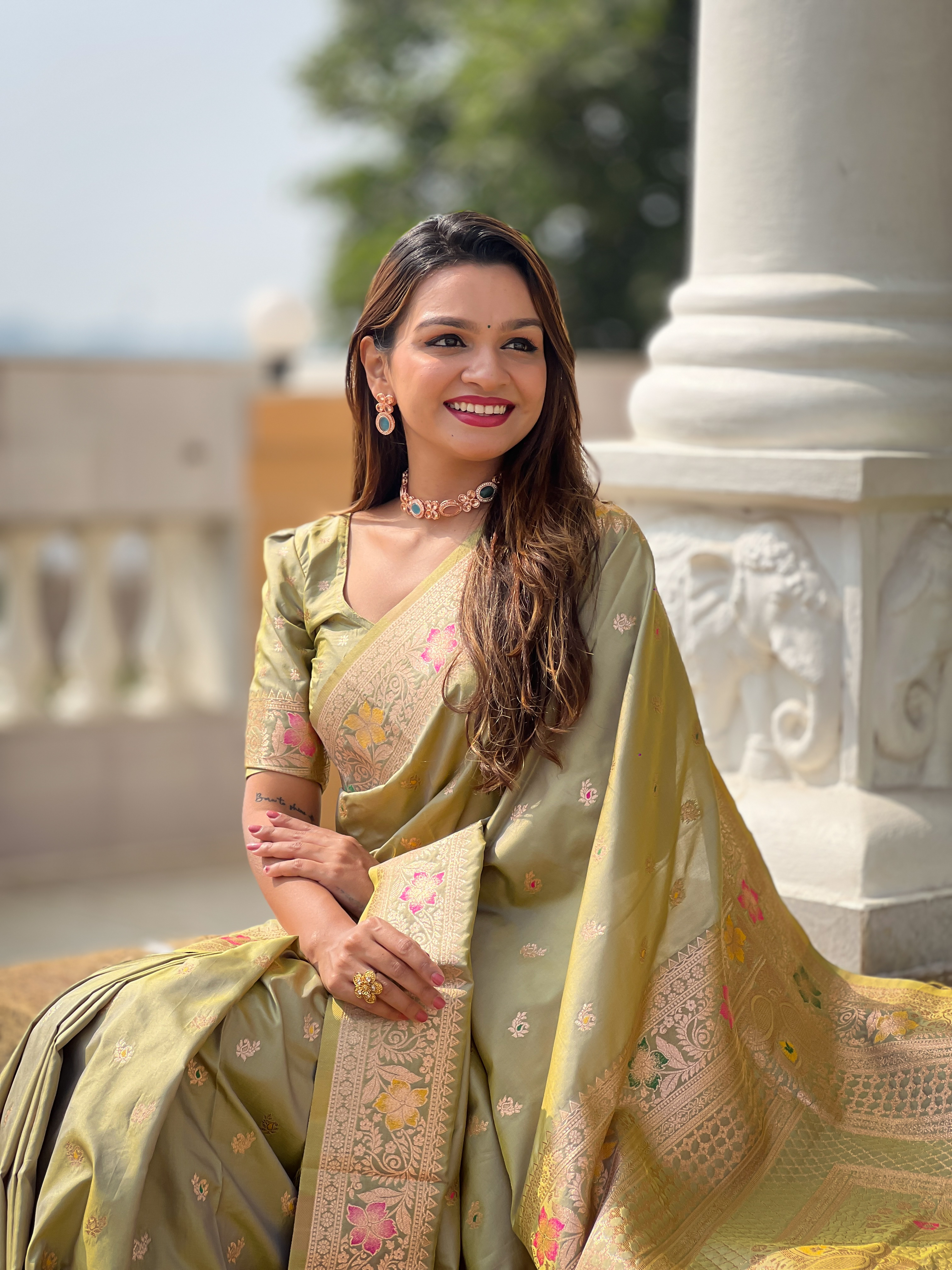 Adorn yourself in the beauty of this mehendi green Banarasi silk saree