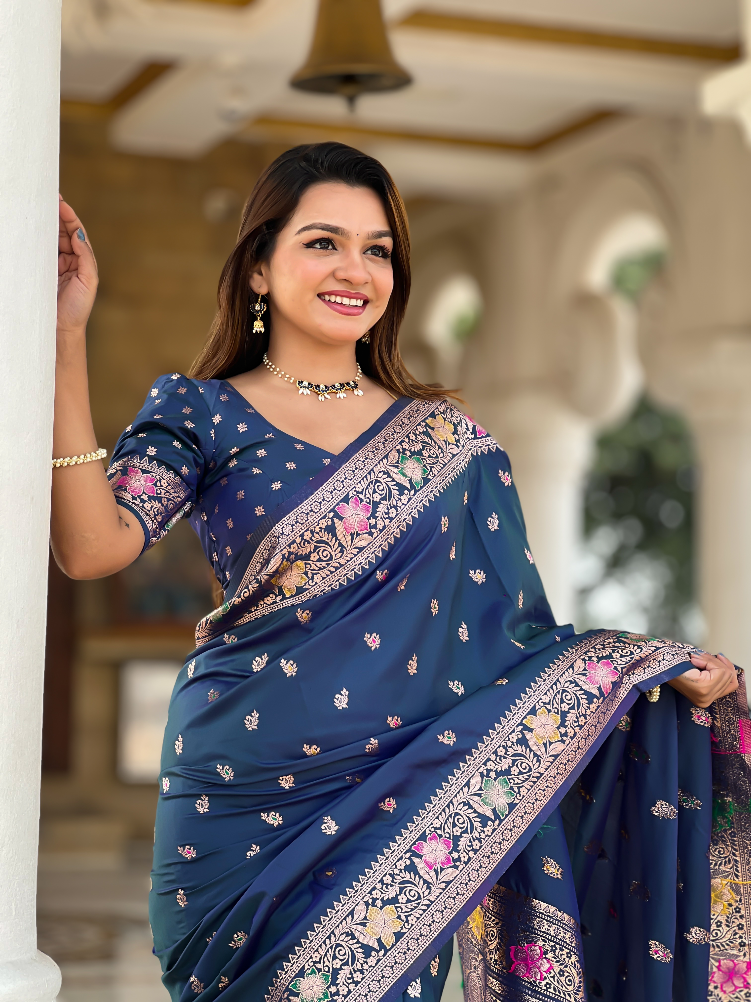 Drape yourself in the captivating beauty of this peacock blue Banarasi silk saree