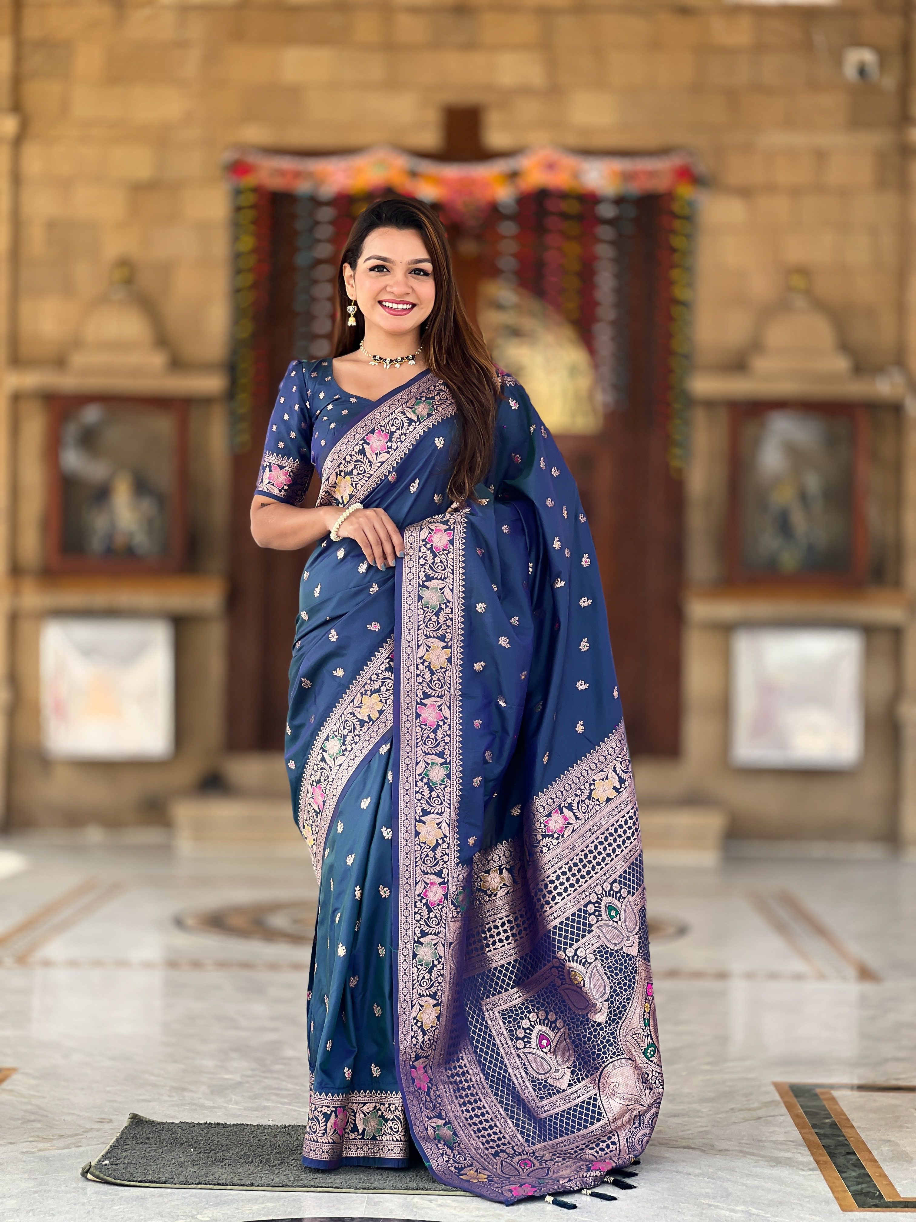 Drape yourself in the captivating beauty of this peacock blue Banarasi silk saree