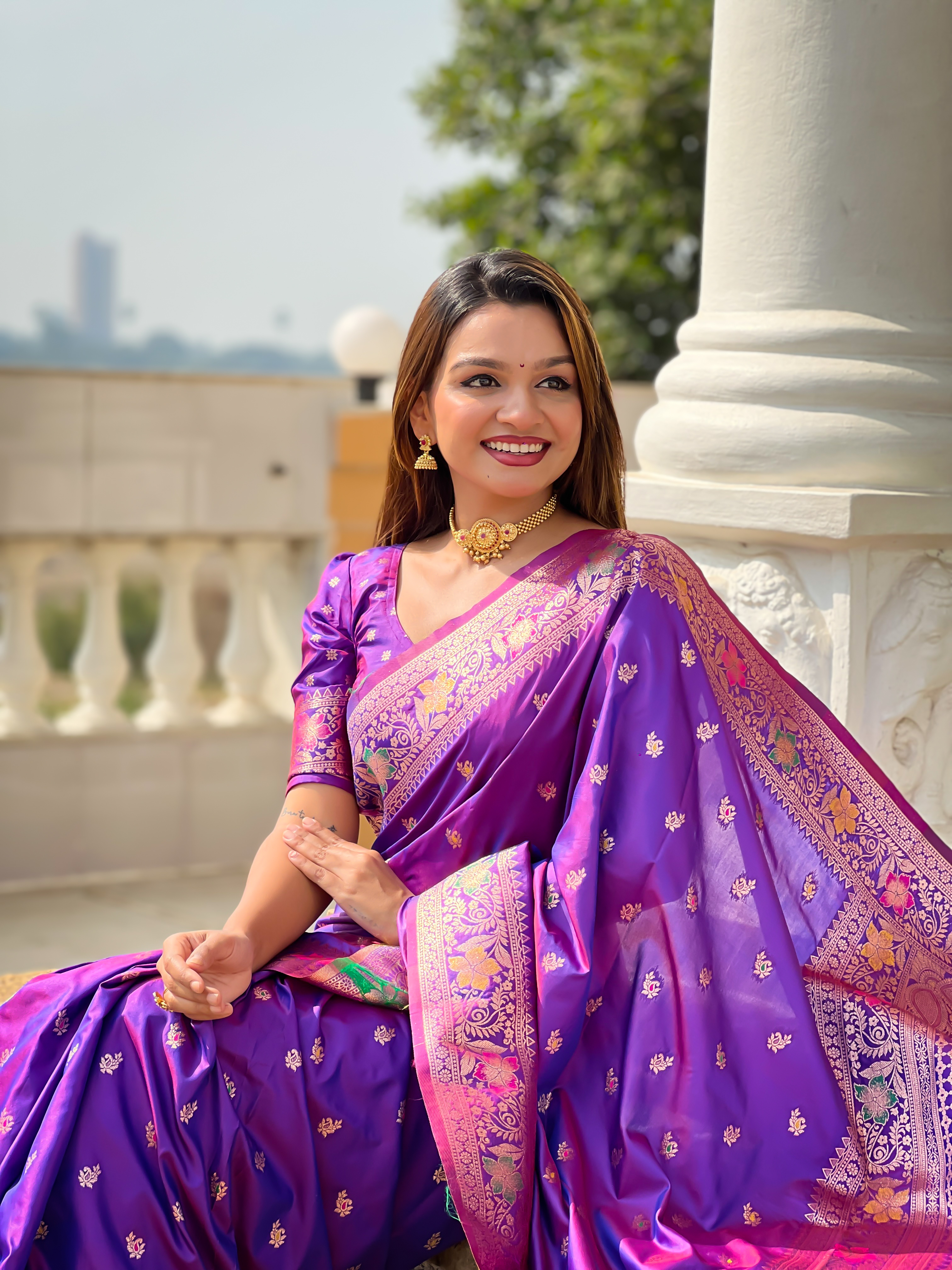 Enchant everyone with the regal charm of this violet Banarasi silk saree