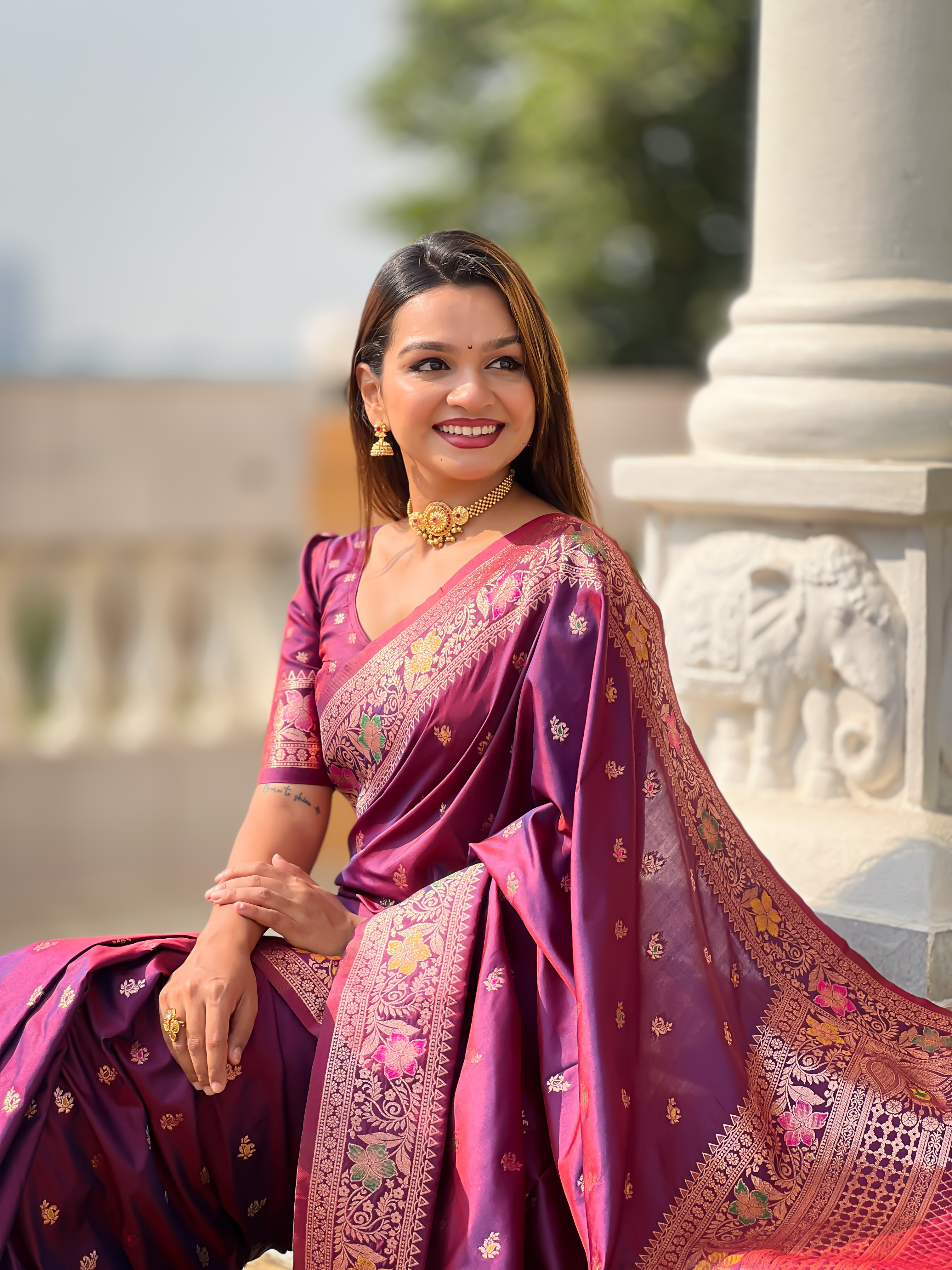 Indulge in the rich elegance of this wine-coloured Banarasi silk saree