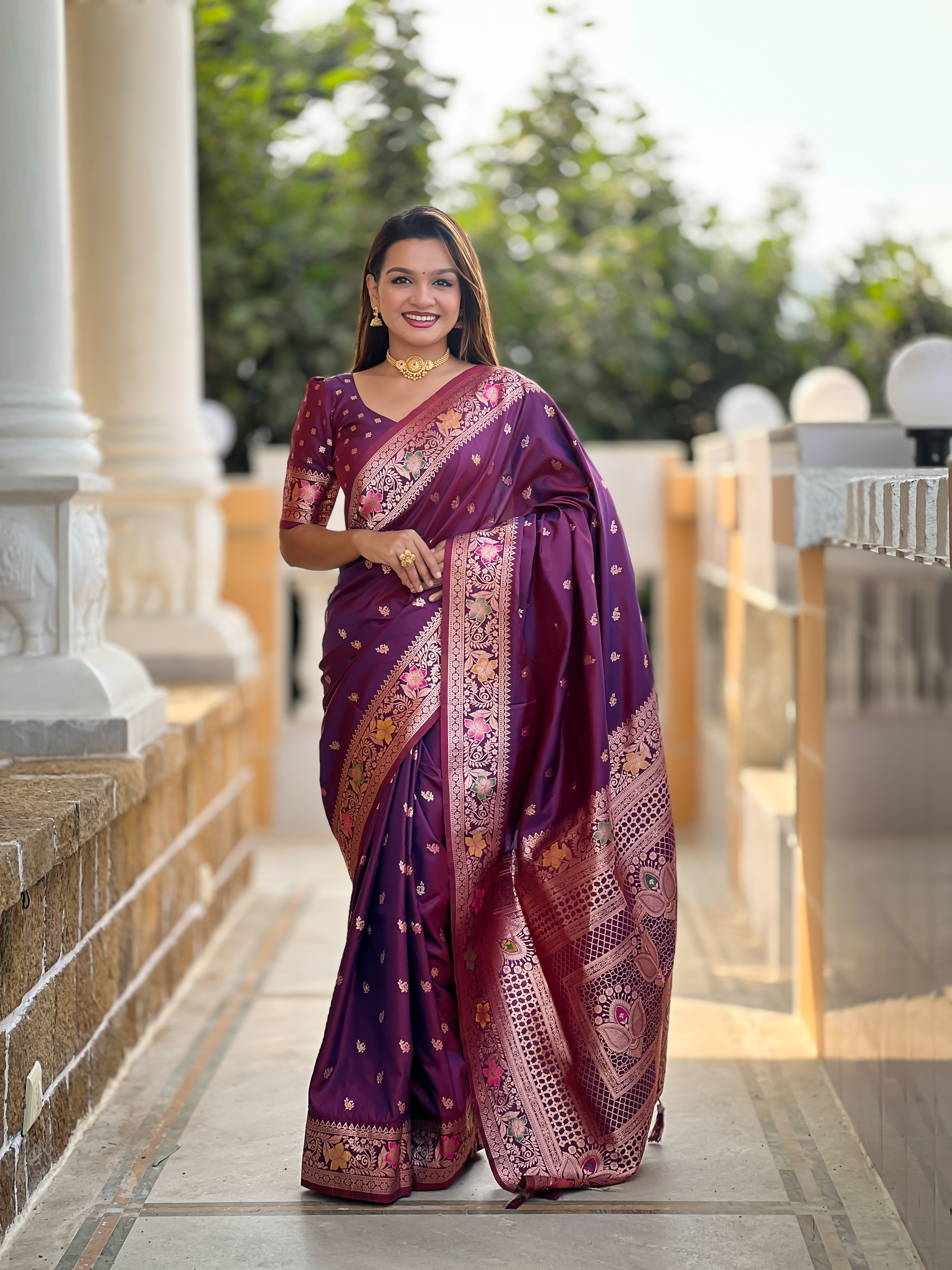 Indulge in the rich elegance of this wine-coloured Banarasi silk saree