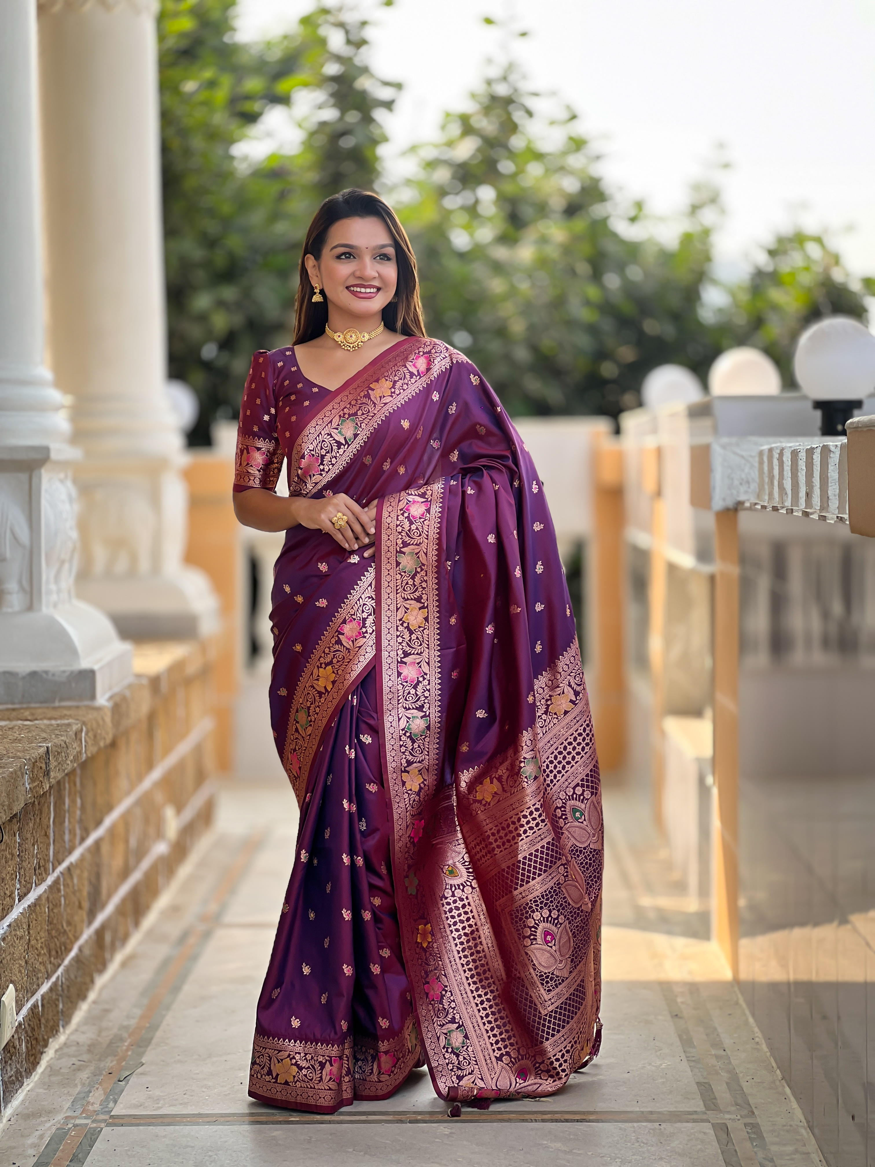 Indulge in the rich elegance of this wine-coloured Banarasi silk saree