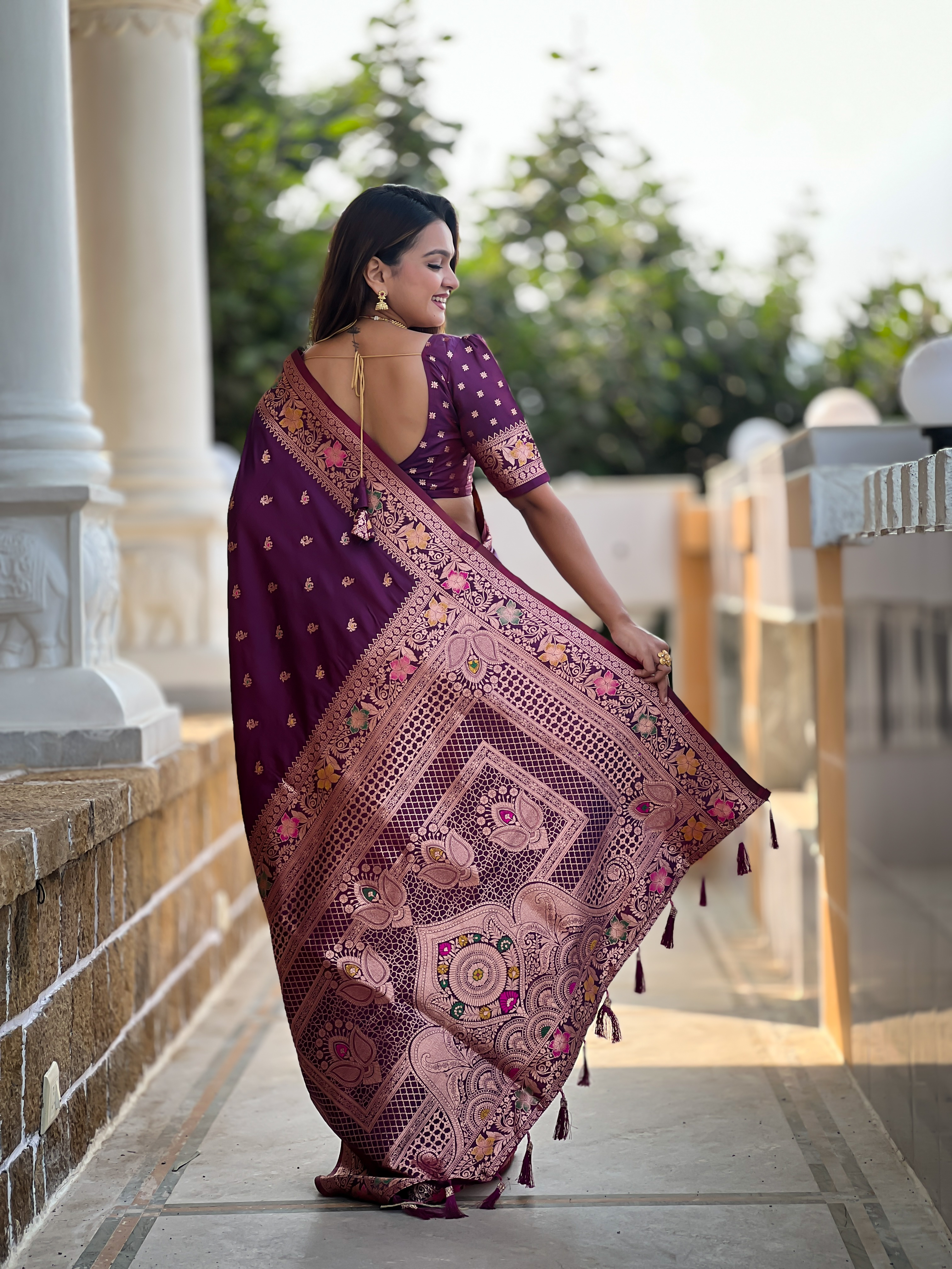 Indulge in the rich elegance of this wine-coloured Banarasi silk saree