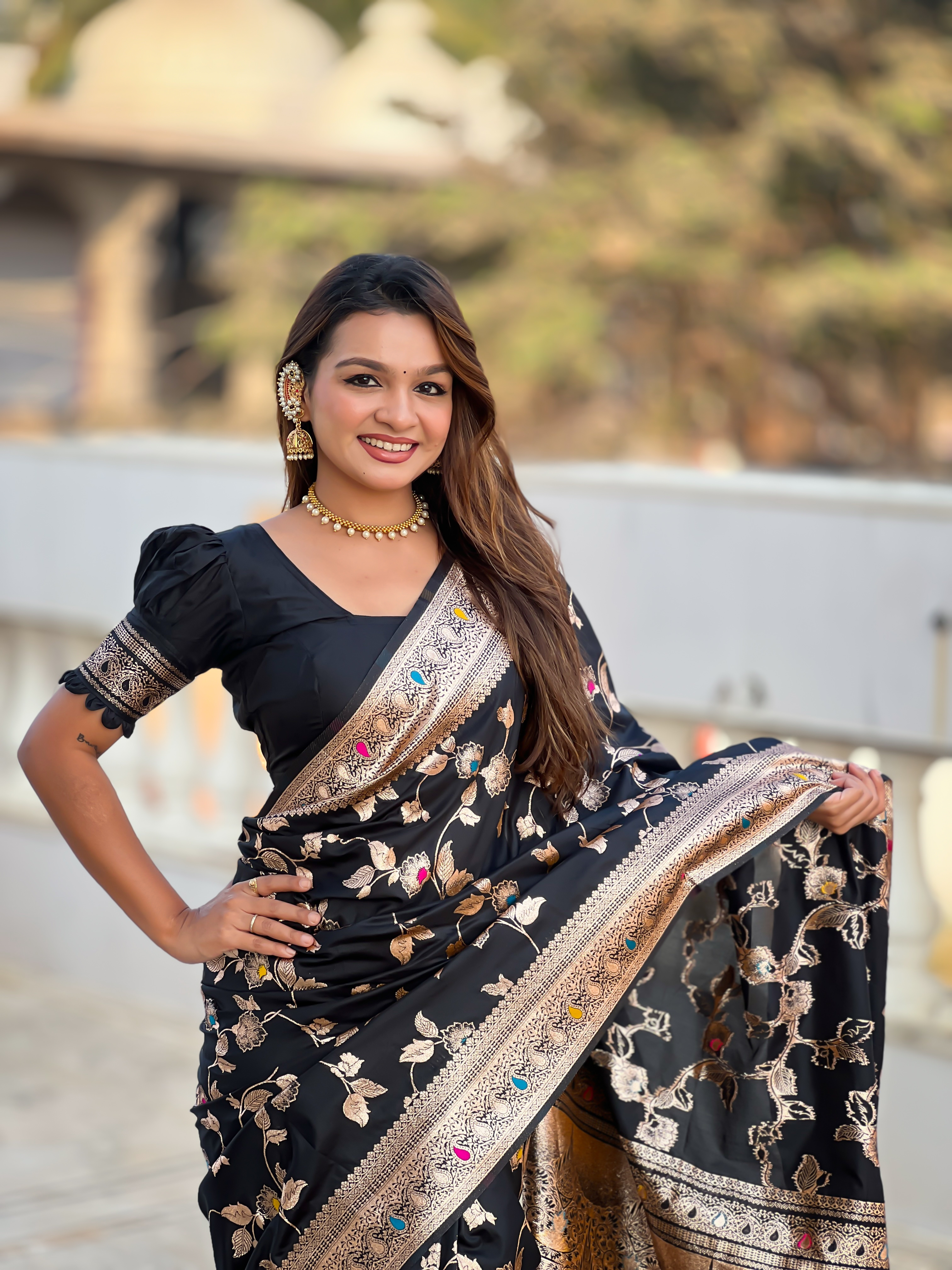 Make a bold and elegant statement with this exquisite black Banarasi silk saree