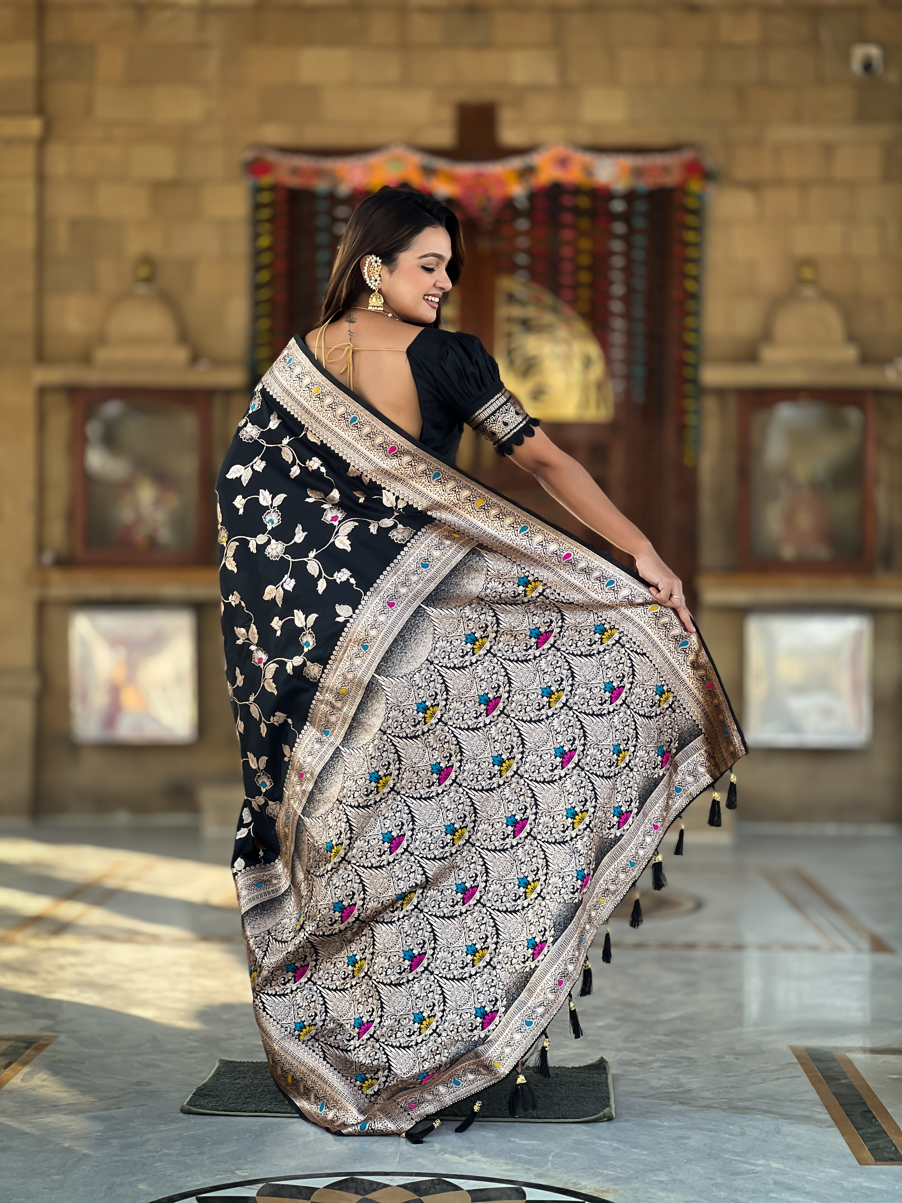 Make a bold and elegant statement with this exquisite black Banarasi silk saree