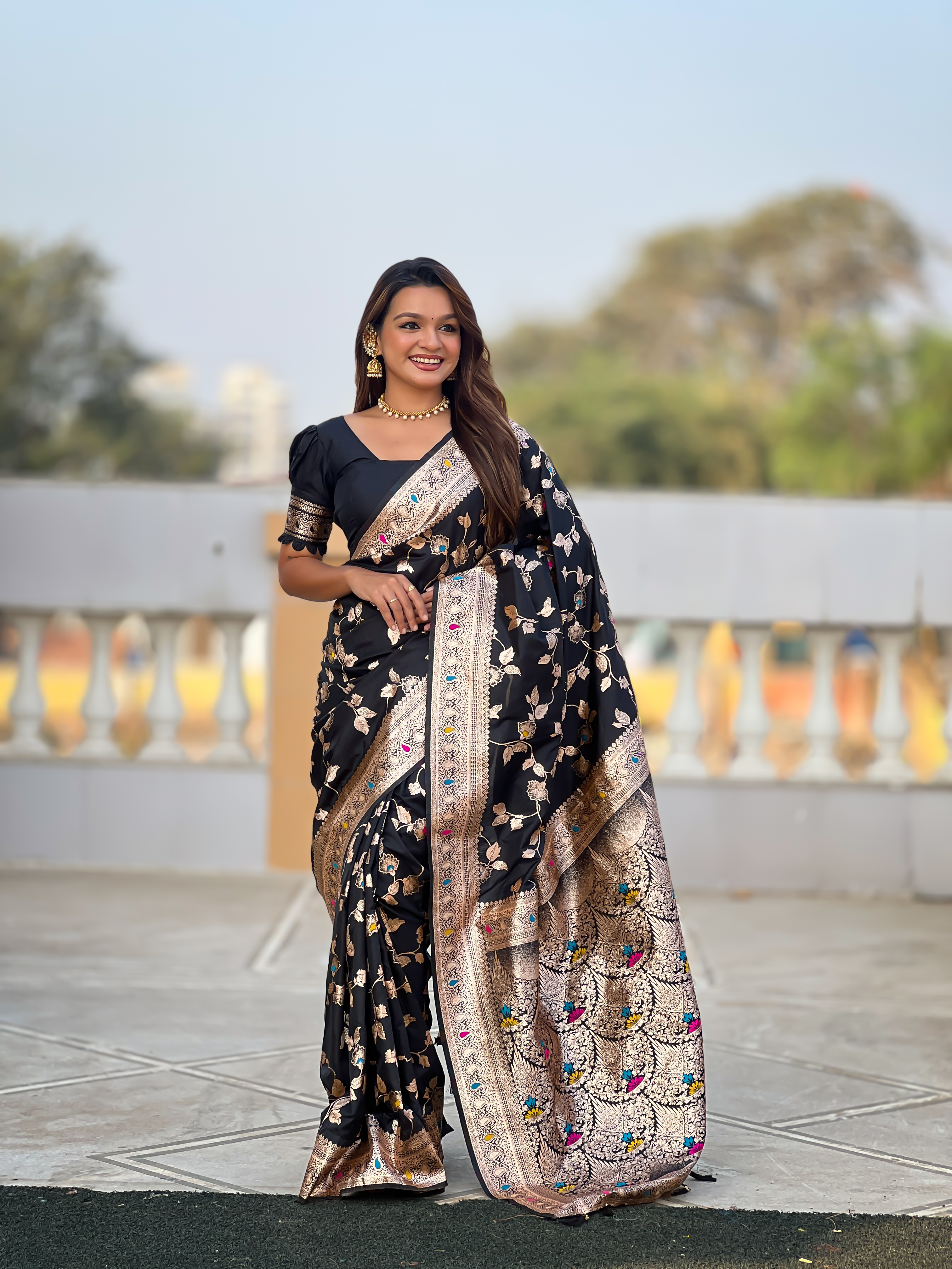 Make a bold and elegant statement with this exquisite black Banarasi silk saree