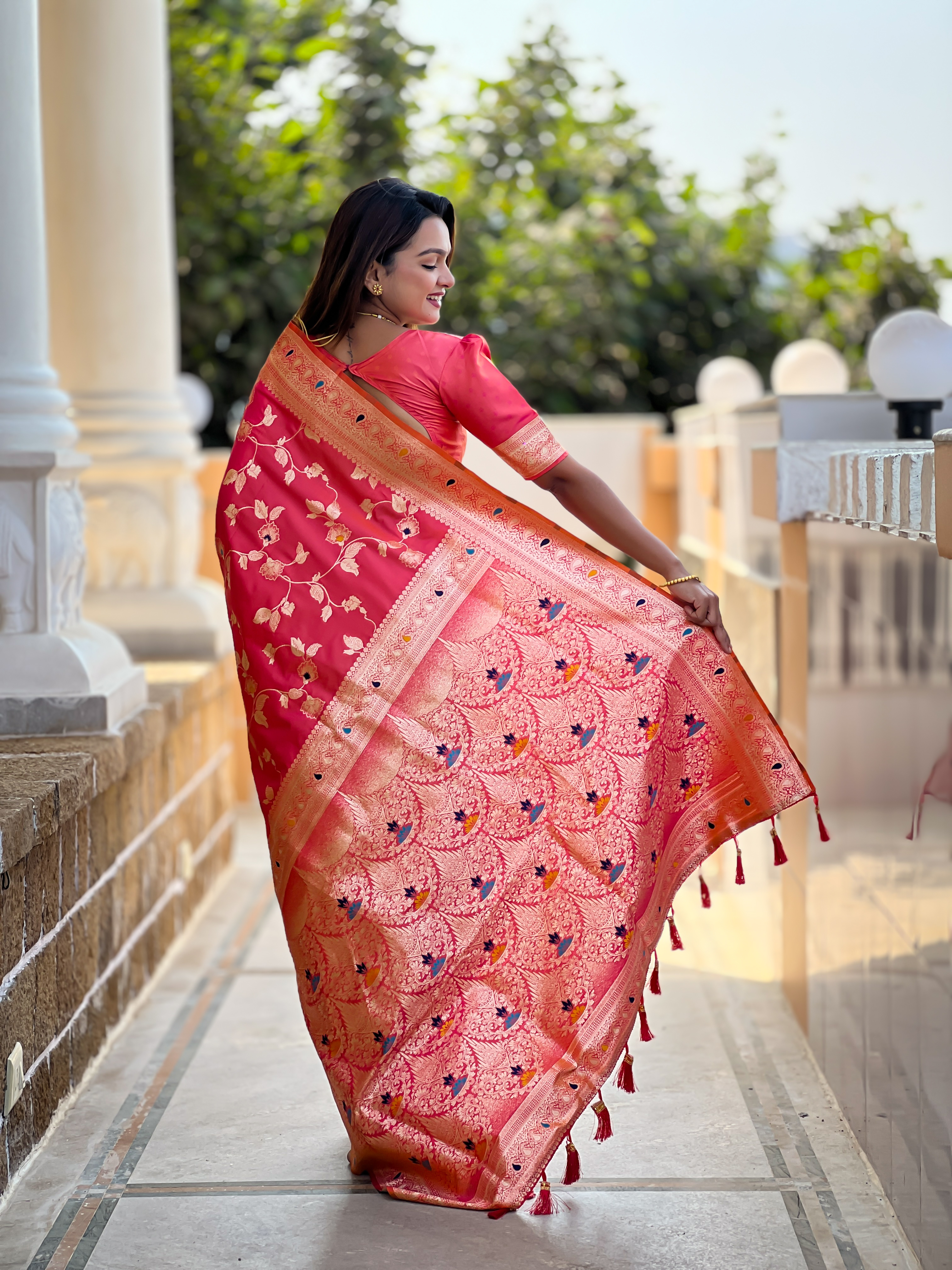 Radiate grace with this enchanting pink Banarasi silk saree