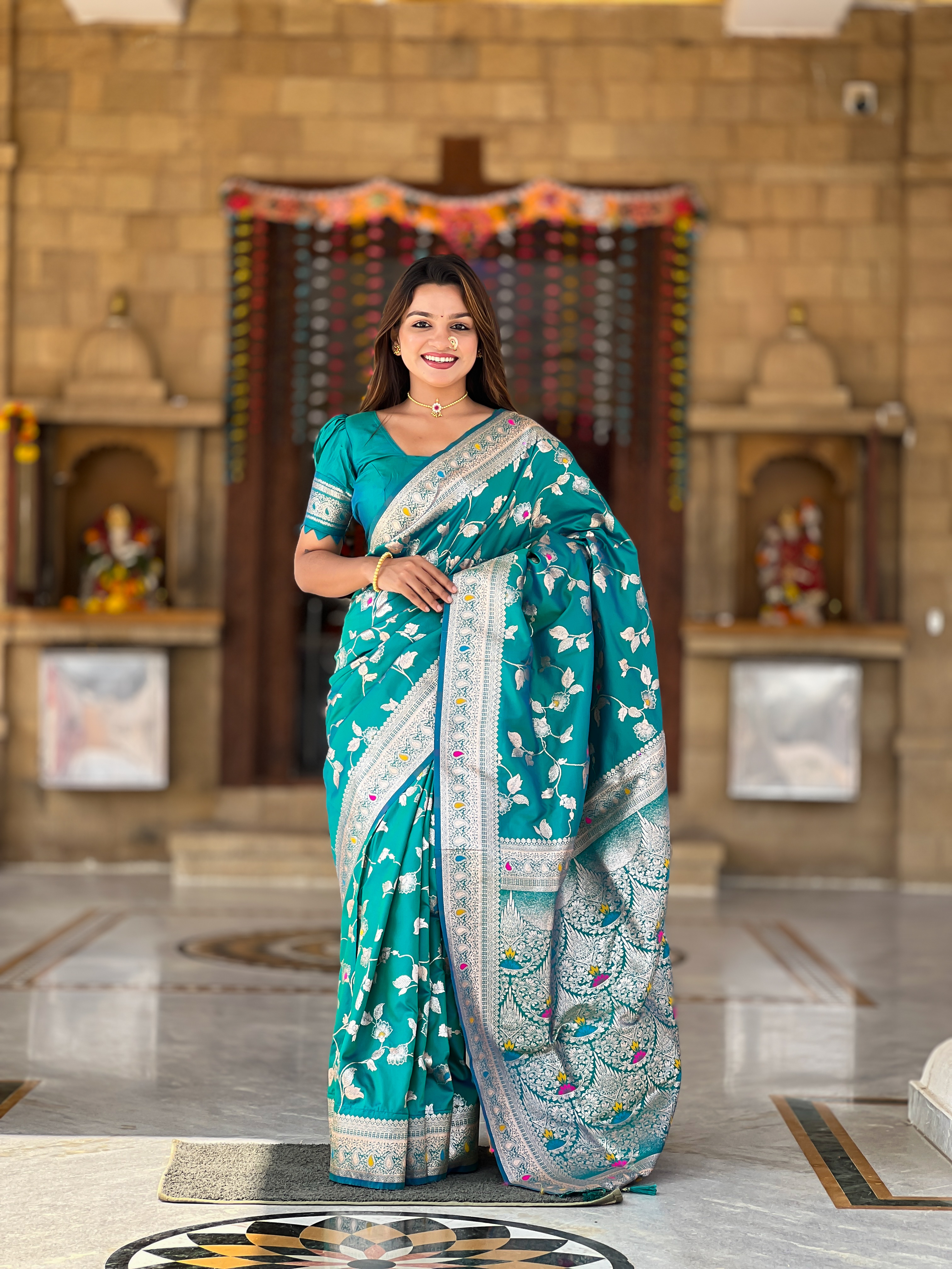 Drape yourself in the elegance of this stunning Rama green Banarasi silk saree