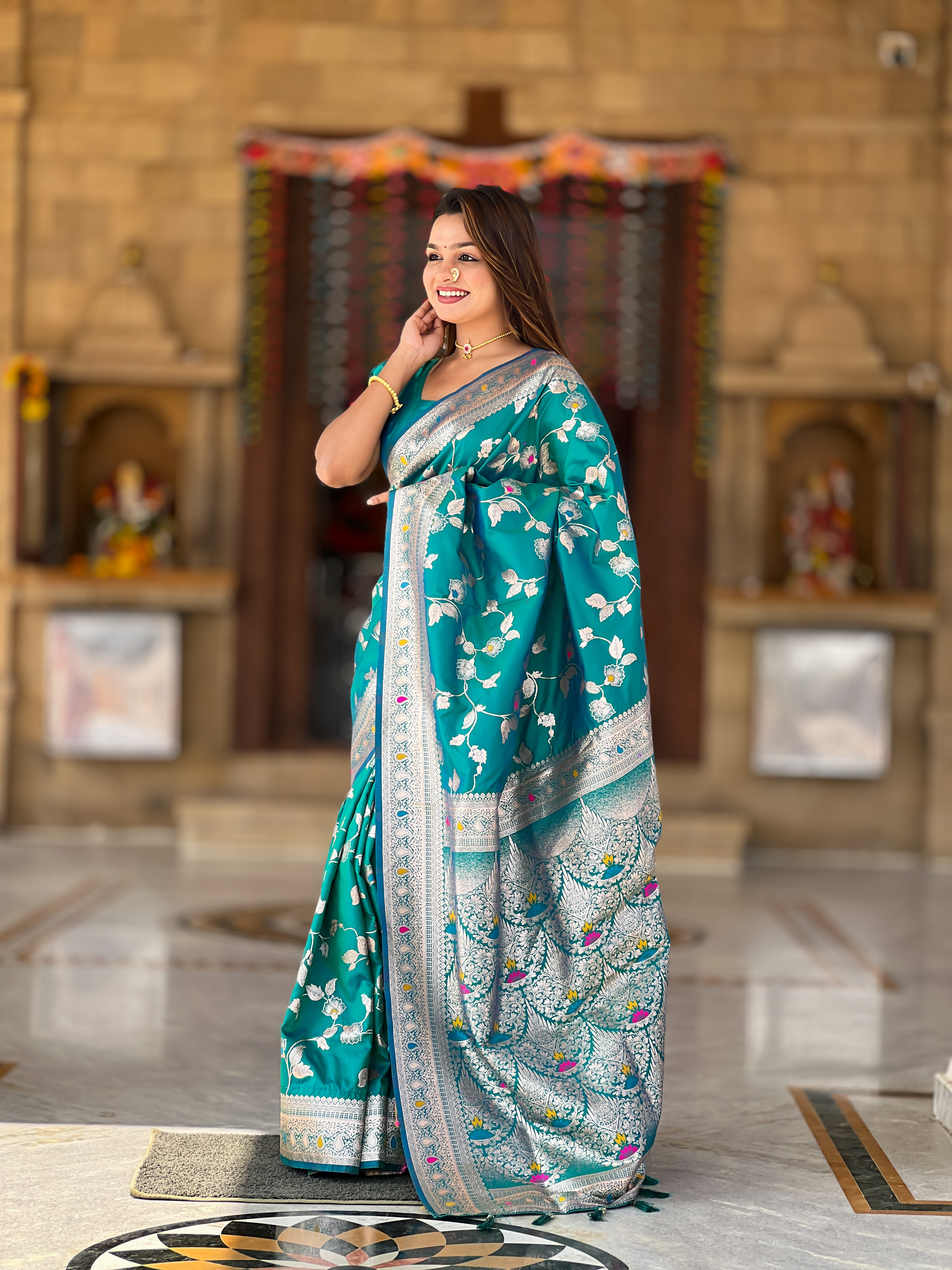 Drape yourself in the elegance of this stunning Rama green Banarasi silk saree