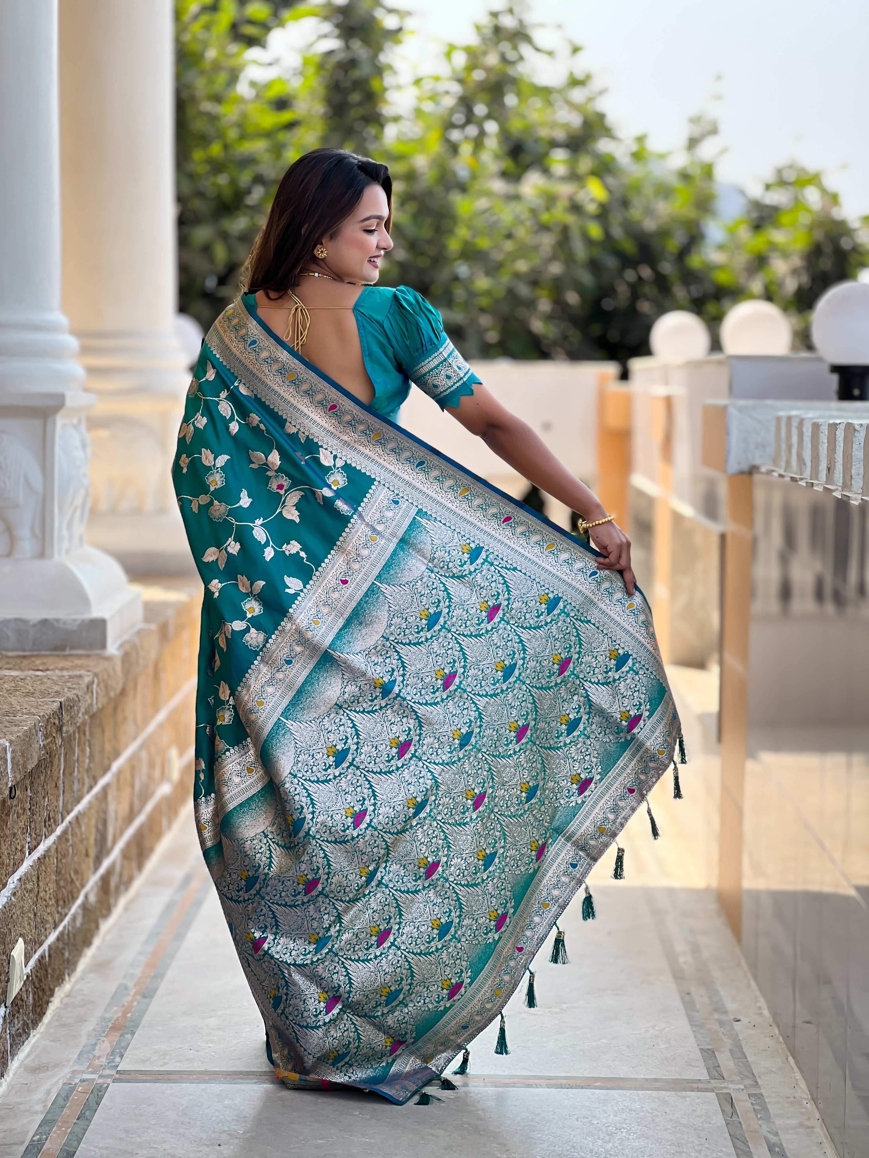 Drape yourself in the elegance of this stunning Rama green Banarasi silk saree